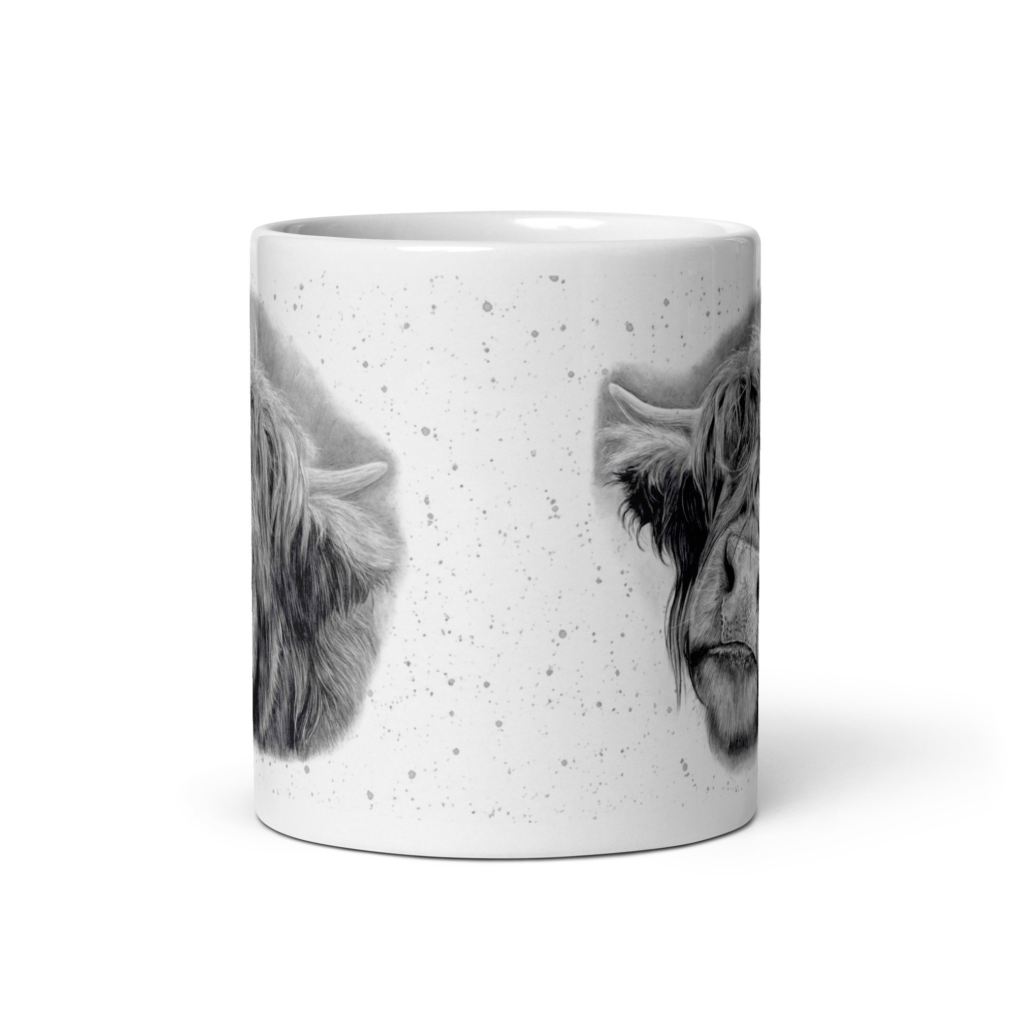 Angled view of a Highland Cow ceramic mug displaying detailed artwork by Matt Lloyd against a subtle grey fleck background on a glossy white mug.