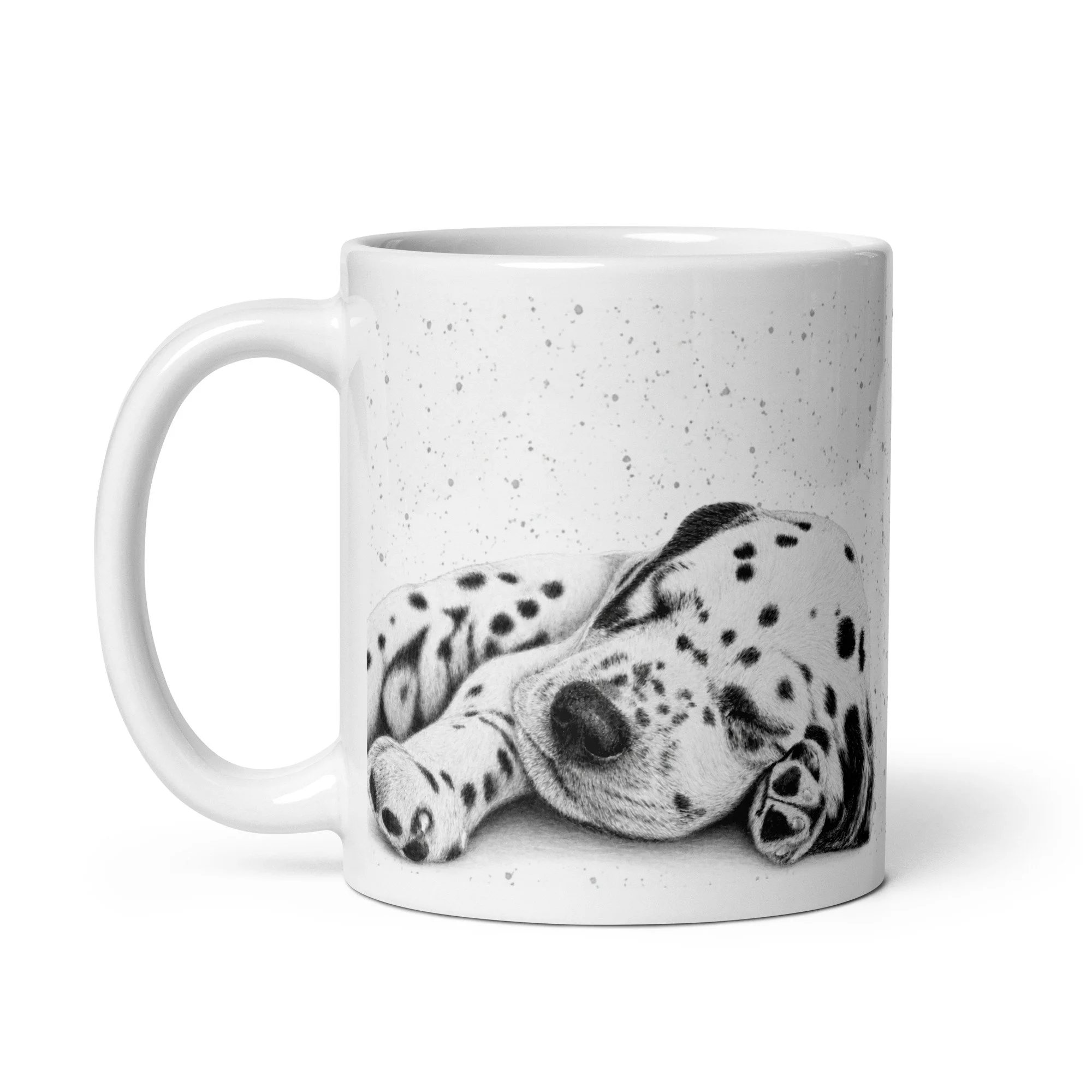 Side view of a ceramic mug featuring a sleeping Dalmatian puppy illustration by Matt Lloyd with a grey fleck background.