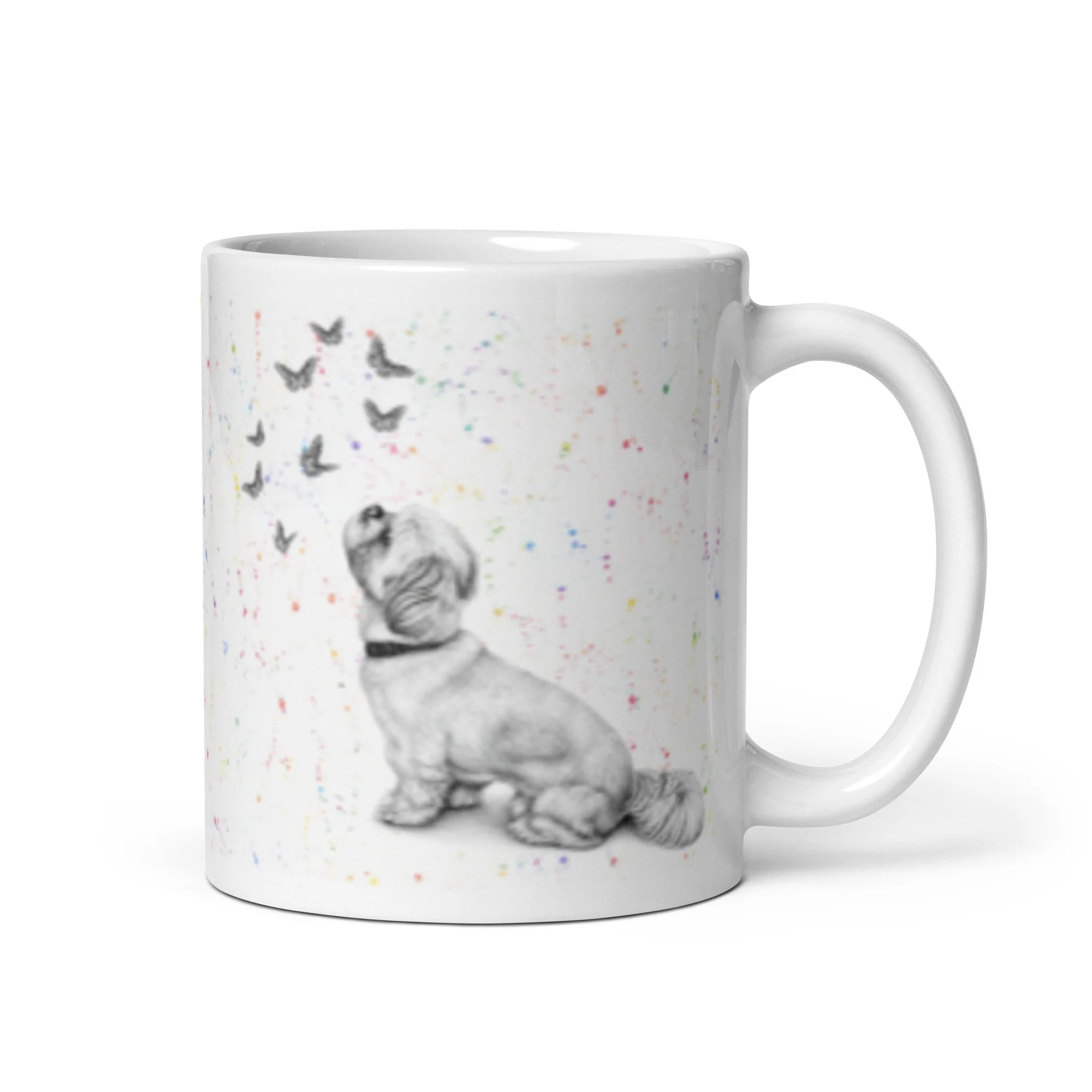 White ceramic mug featuring original Shih Tzu and butterfly artwork by Matthew Lloyd with a colourful fleck background.