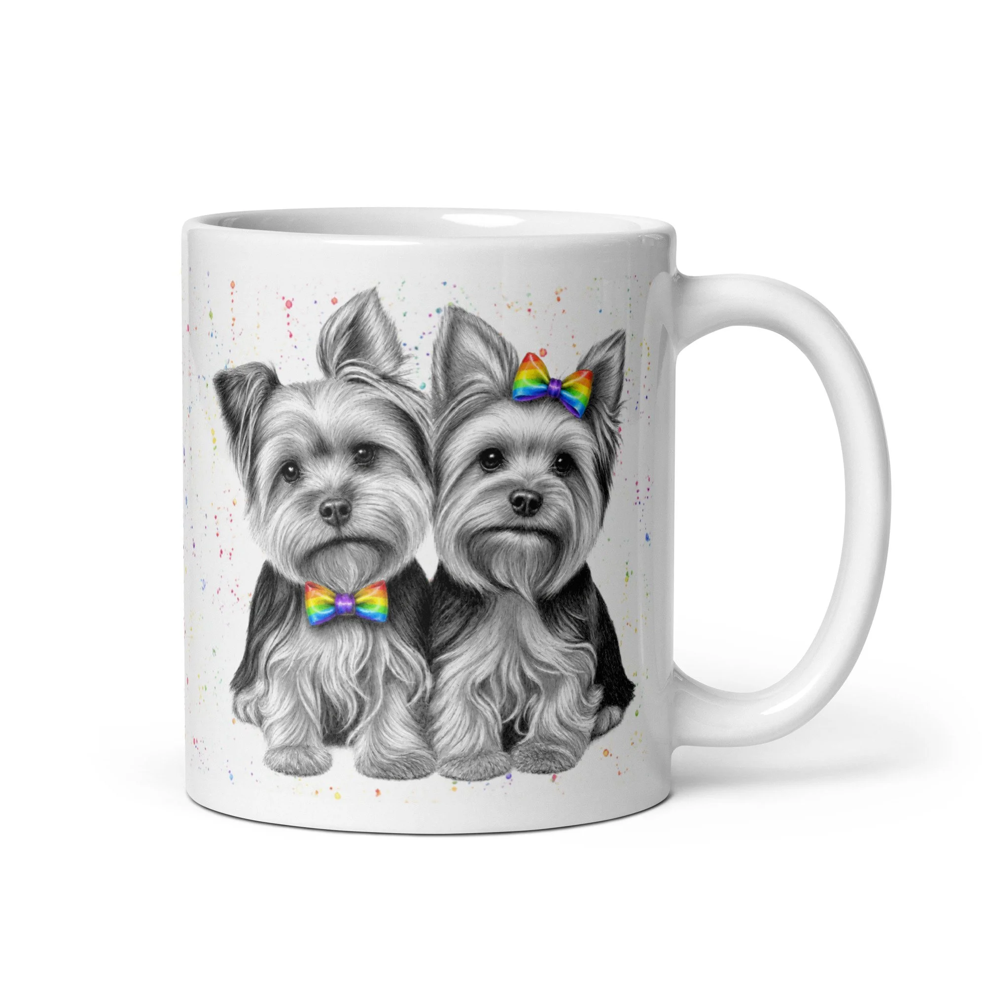 White ceramic mug featuring a male and female Yorkshire Terrier with colourful rainbow dicky bow and hair bow, illustrated by Matthew Lloyd.