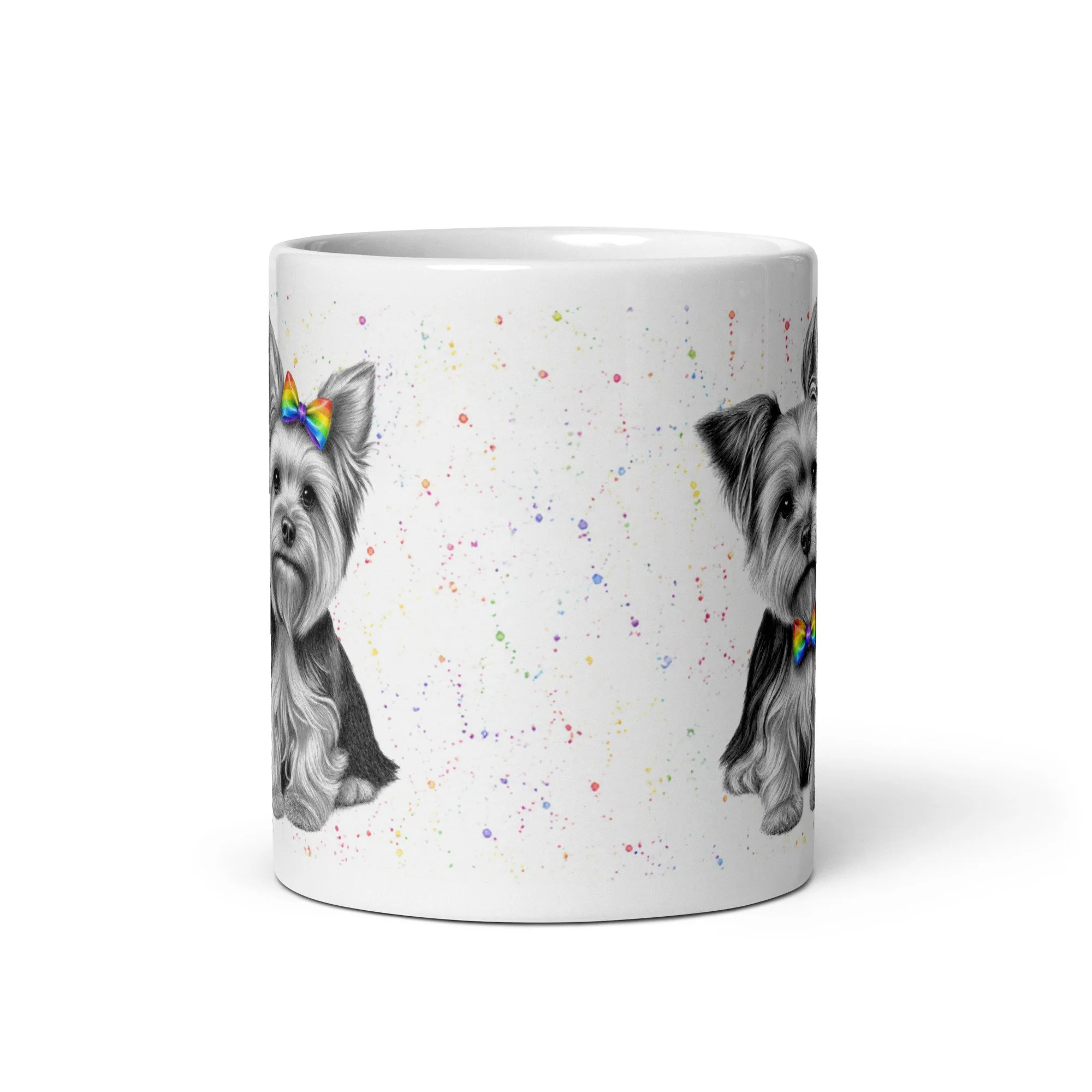 Ceramic coffee mug displaying two Yorkshire Terriers with matching rainbow bows, created by UK artist Matthew Lloyd.