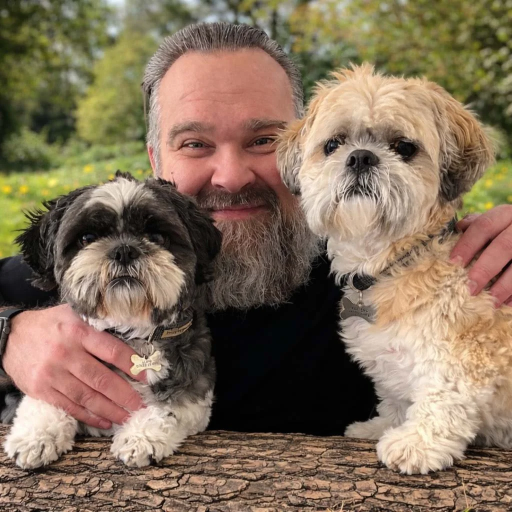 Matt the pet portrait artist with his beloved Shih Tzus Chester and Ozzy