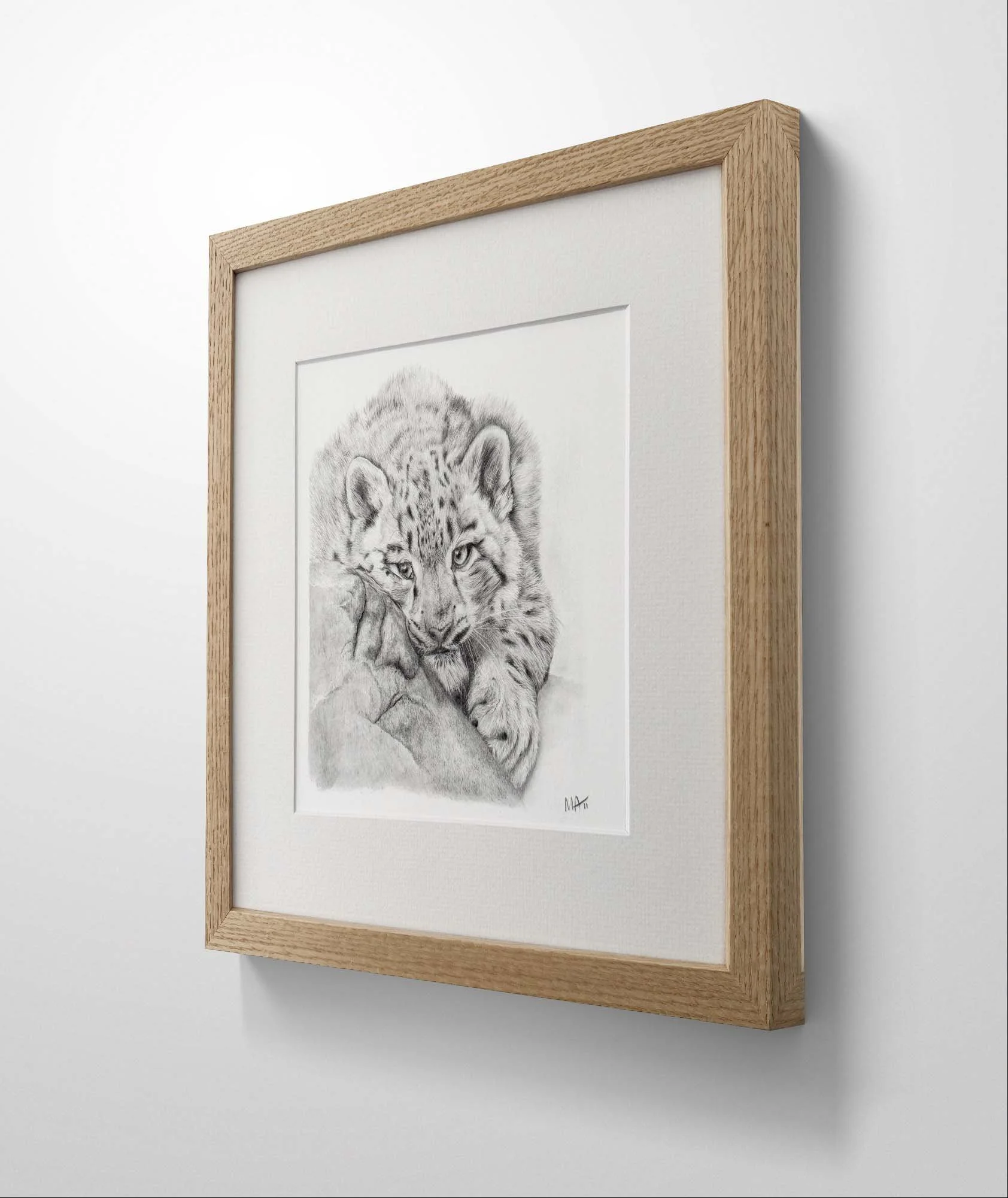 Snow leopard graphite drawing print in oak frame side view.jpg