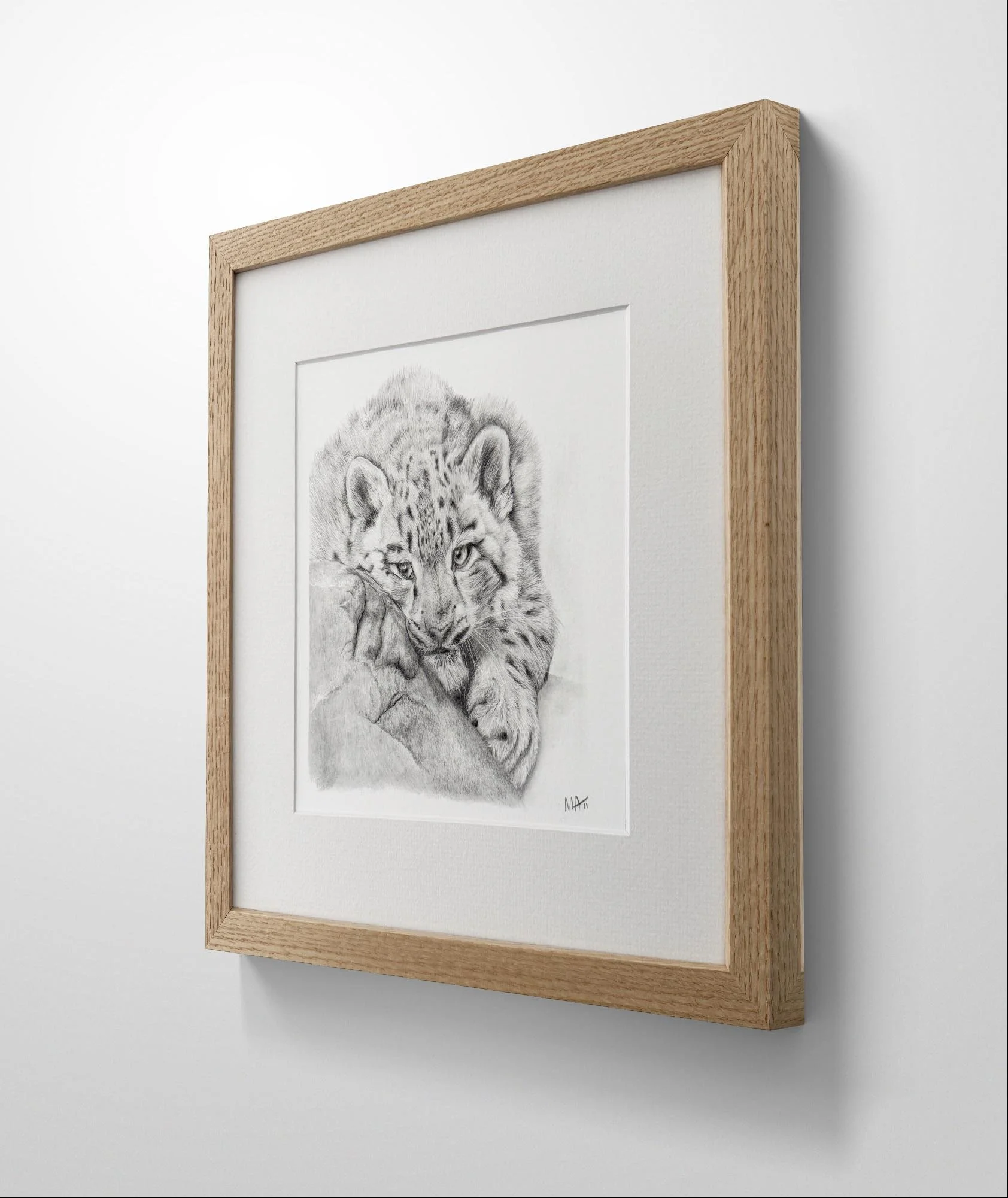 Snow Leopard mounted oak frame print side view.jpg