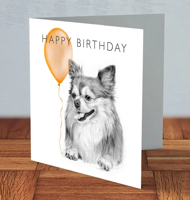 Hand-drawn Chihuahua birthday card featuring a cute Chihuahua holding a balloon, with a cheerful celebratory design