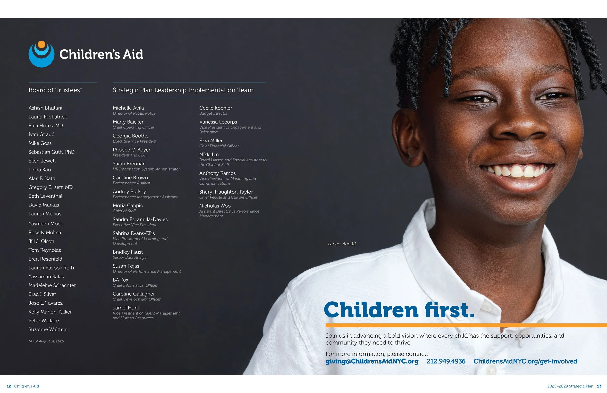 Smiling young boy on dark background wearing a white polo shirts with dreadlocks, looking off camera 
