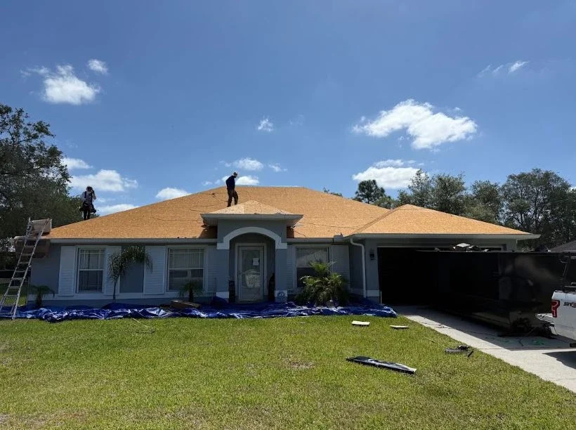 Residential shingle roof replacement in progress by Craig Fass Roofing in Brooksville, FL.