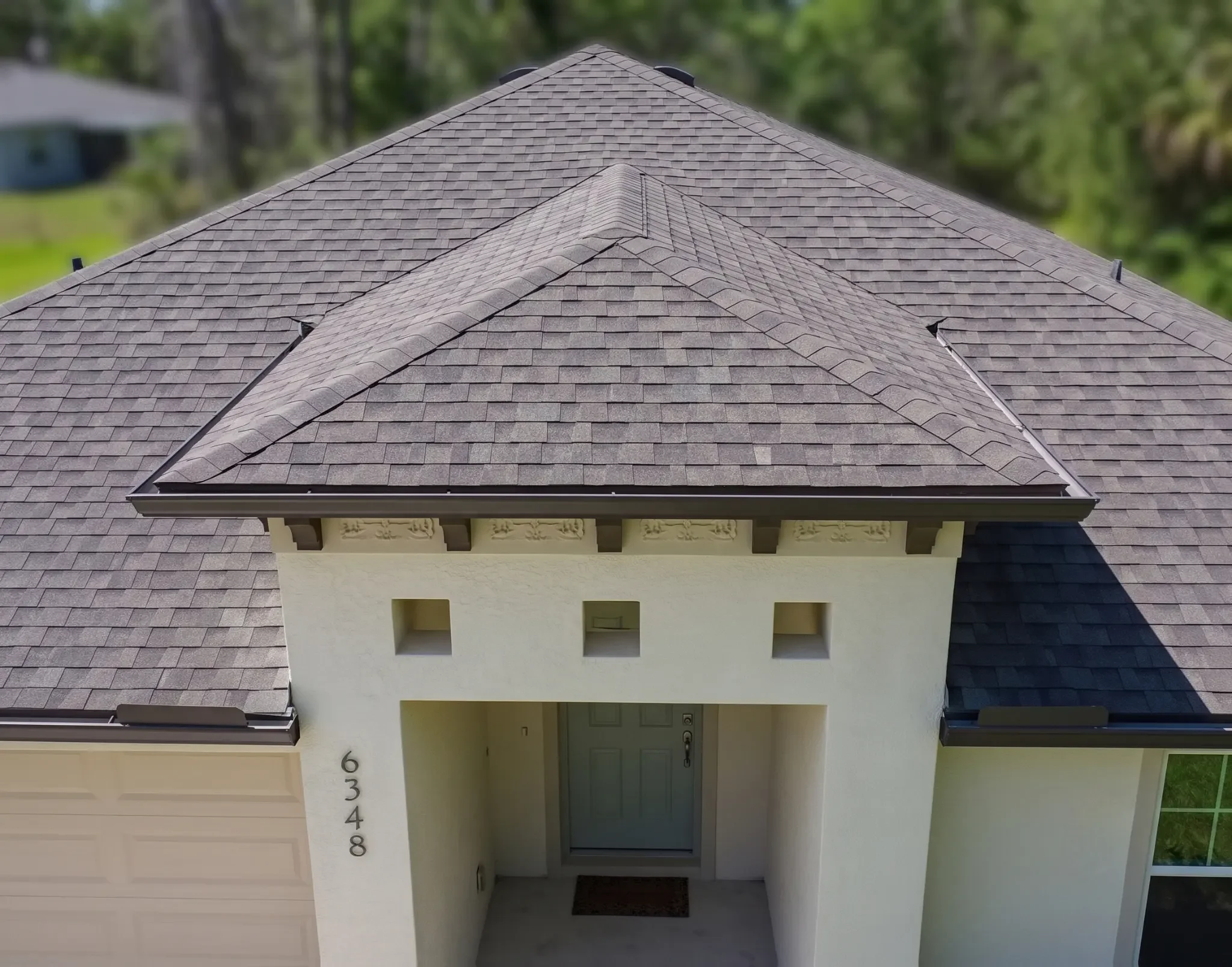 Architectural shingle roof replacement on a residential home in Royal Highlands, Weeki Wachee, FL by Craig Fass Roofing.