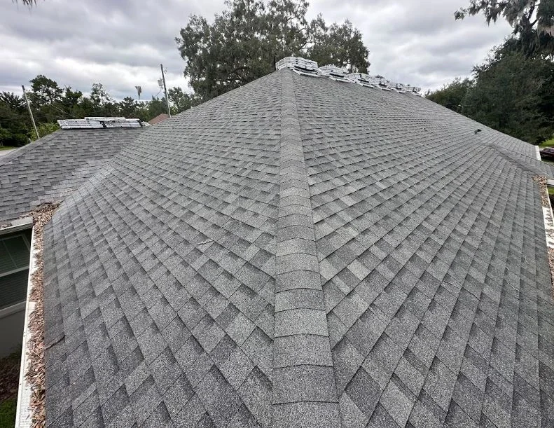 Architectural shingles and roof pitch installation by Craig Fass Roofing during a Brooksville, FL roof replacement.
