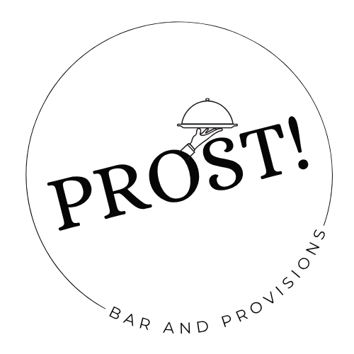 Round logo with a cloche cover icon and the text "PROST!" in large letters. Subtext reads "BAR AND PROVISIONS" curved along the bottom.