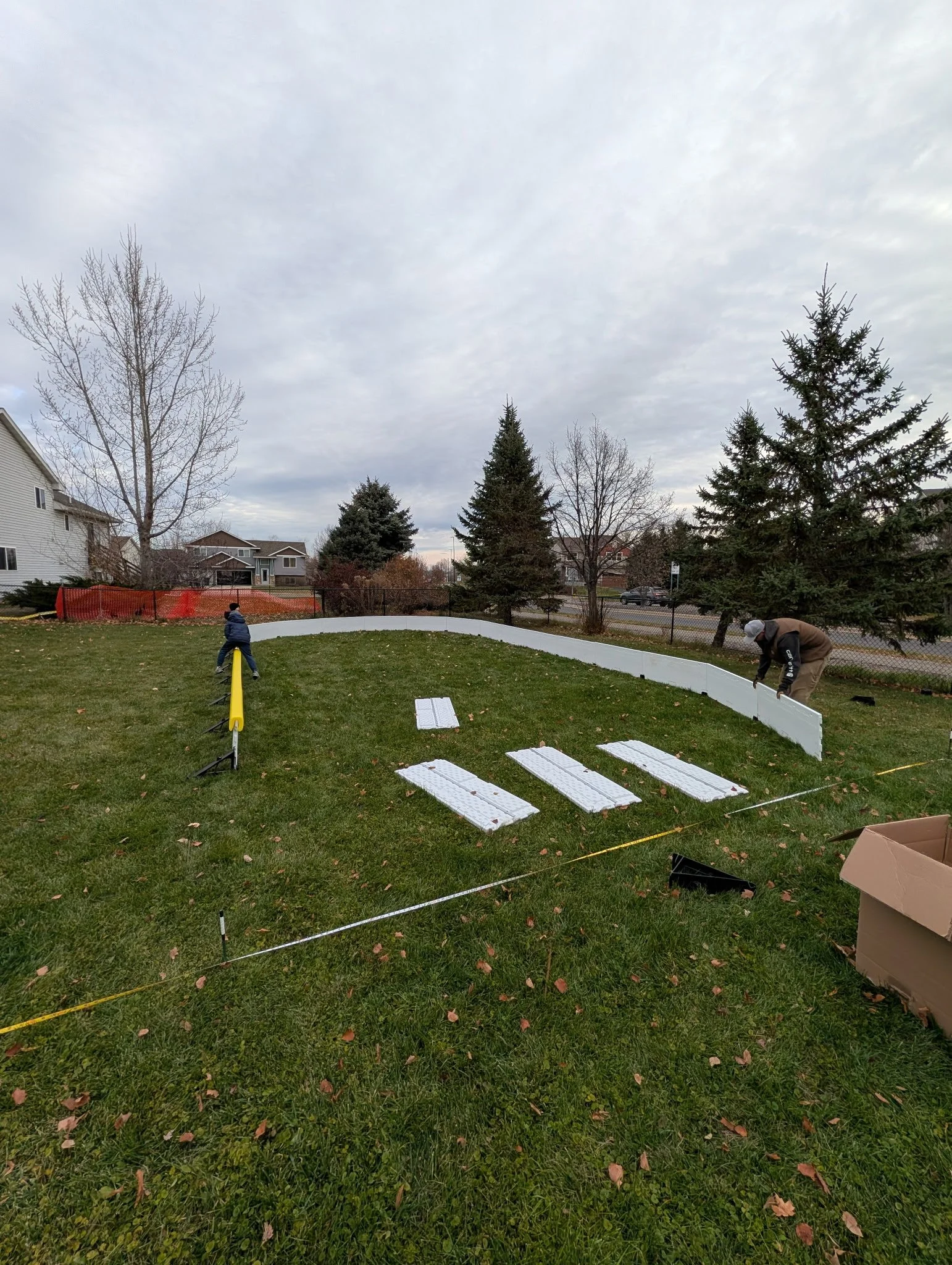 Ice rink boards being installed after slope is checked