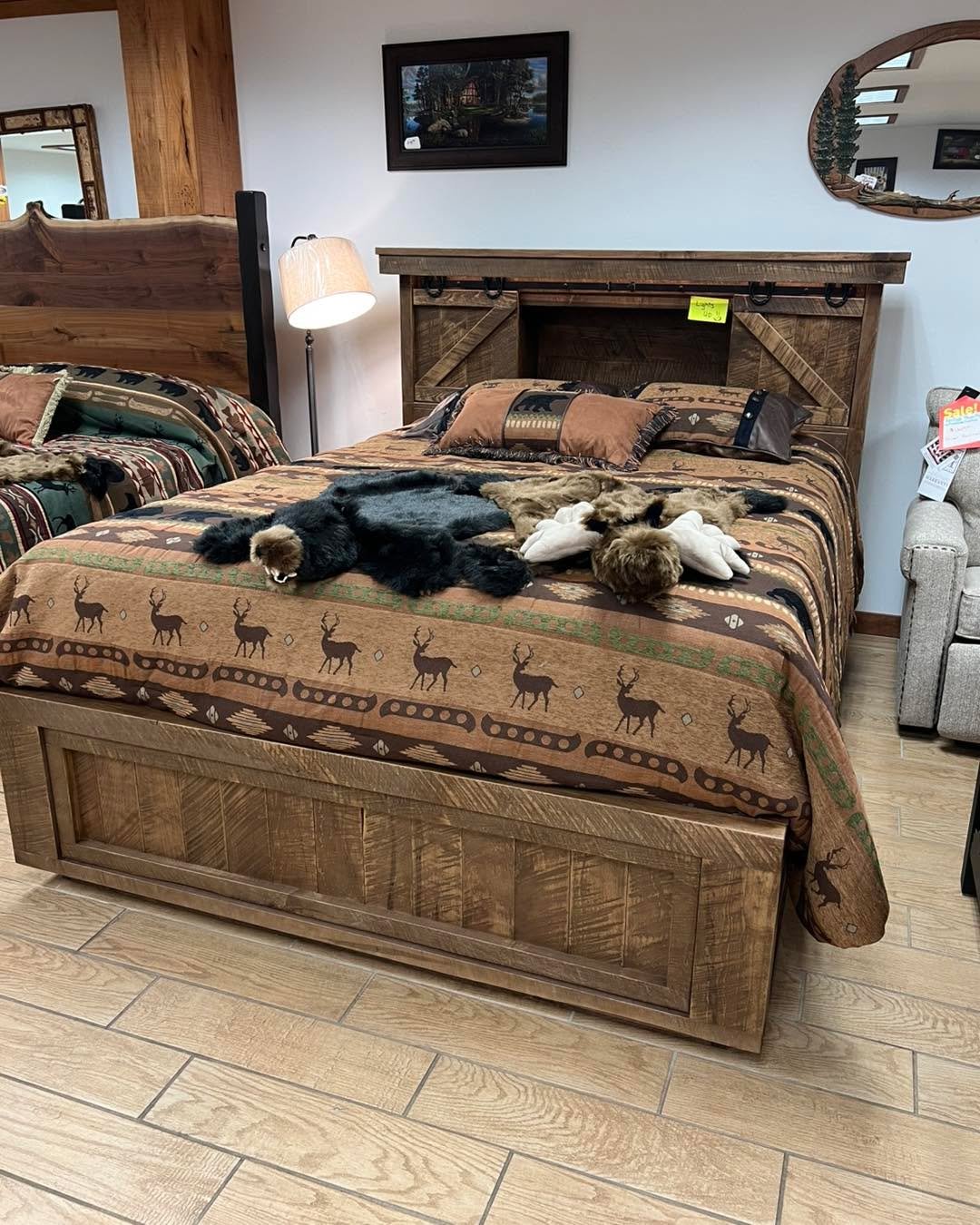 Experience the craftsmanship of Amish-made furniture with this queen-sized platform bed, complete with a bookcase headboard, strip light, pop-up power station, soft-close drawers, and a hidden treasure drawer. Available for purchase as a floor model.
