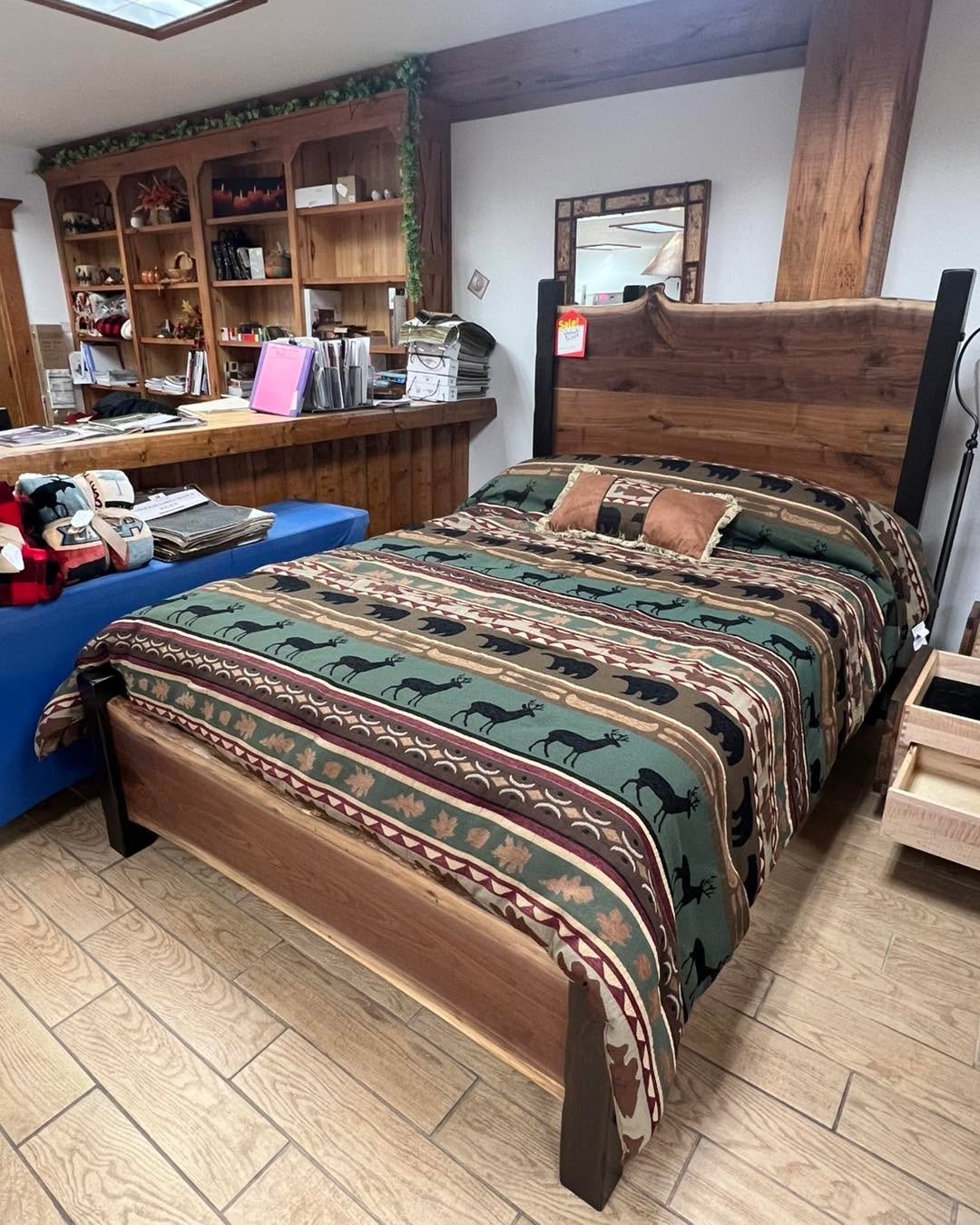 A stunning live edge queen size bed with matching nightstand is available at Rustic Retreat Furniture in Lakewood. These Amish-made furniture pieces are crafted from walnut and exemplifies exceptional quality. Additional matching items can be ordered