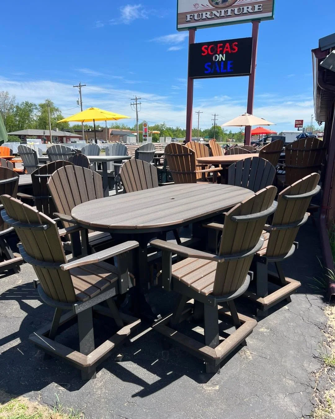 Creekside Poly Lawn Furniture sold at Rustic Retreat Furniture in Lakewood, WI.  Quality Amish built 6&rsquo; oval counter height table with 6 captain swivel chairs.  Color of Black and Brazilian Walnut. $4199.  2 left in stock.  Stop in and see all 