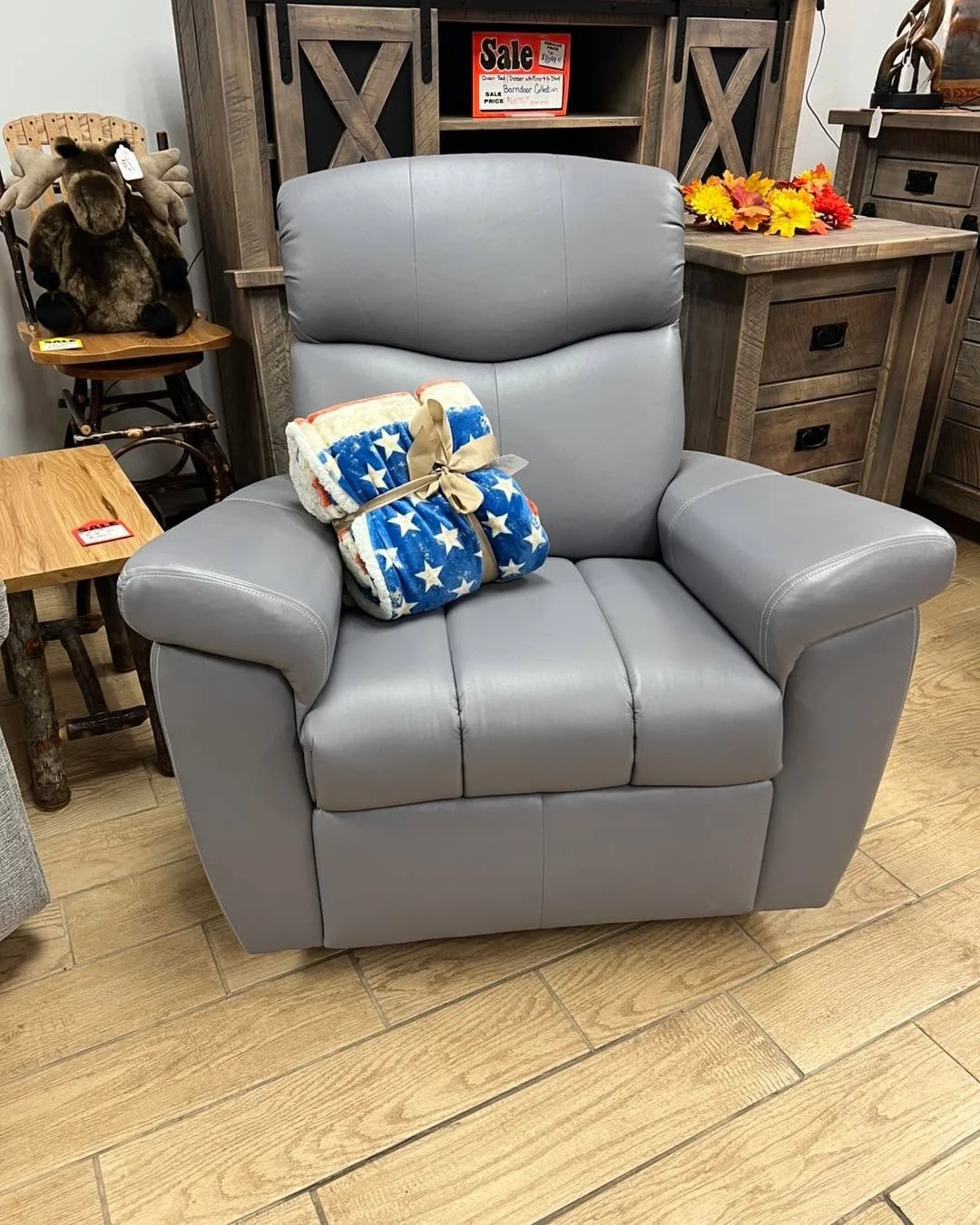 We are clearing out a Lambright Chair that swivels/ glides and reclines.  It is made of ultra leather in color of gray. $700