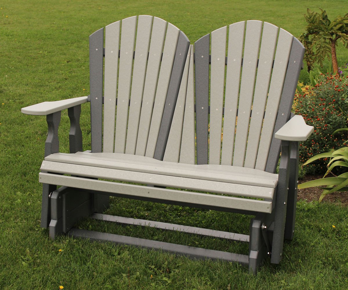 Two-seater Adirondack style glider bench on grass