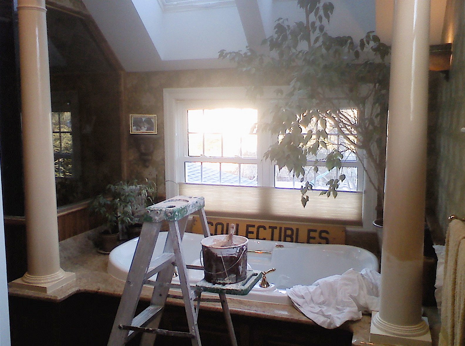 Bathroom with large tub, ladder, paint bucket, plants, and skylight.Home show kitchen floors checkerboard faux painted floor venetian plaster metallic designer finishes paint glazes 