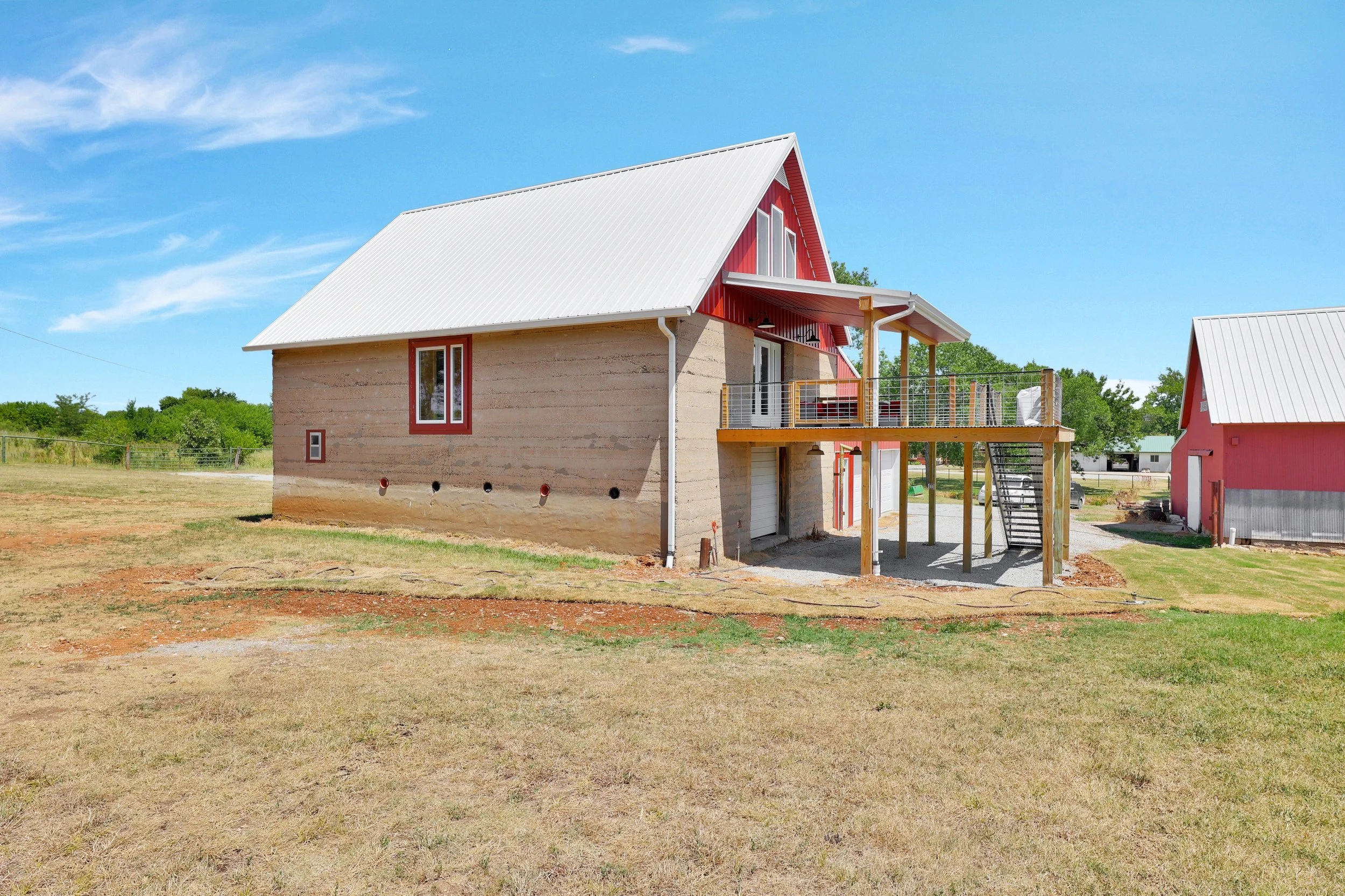 historic-barn-home-renovation-kansas-exterior-elevated-deck-side