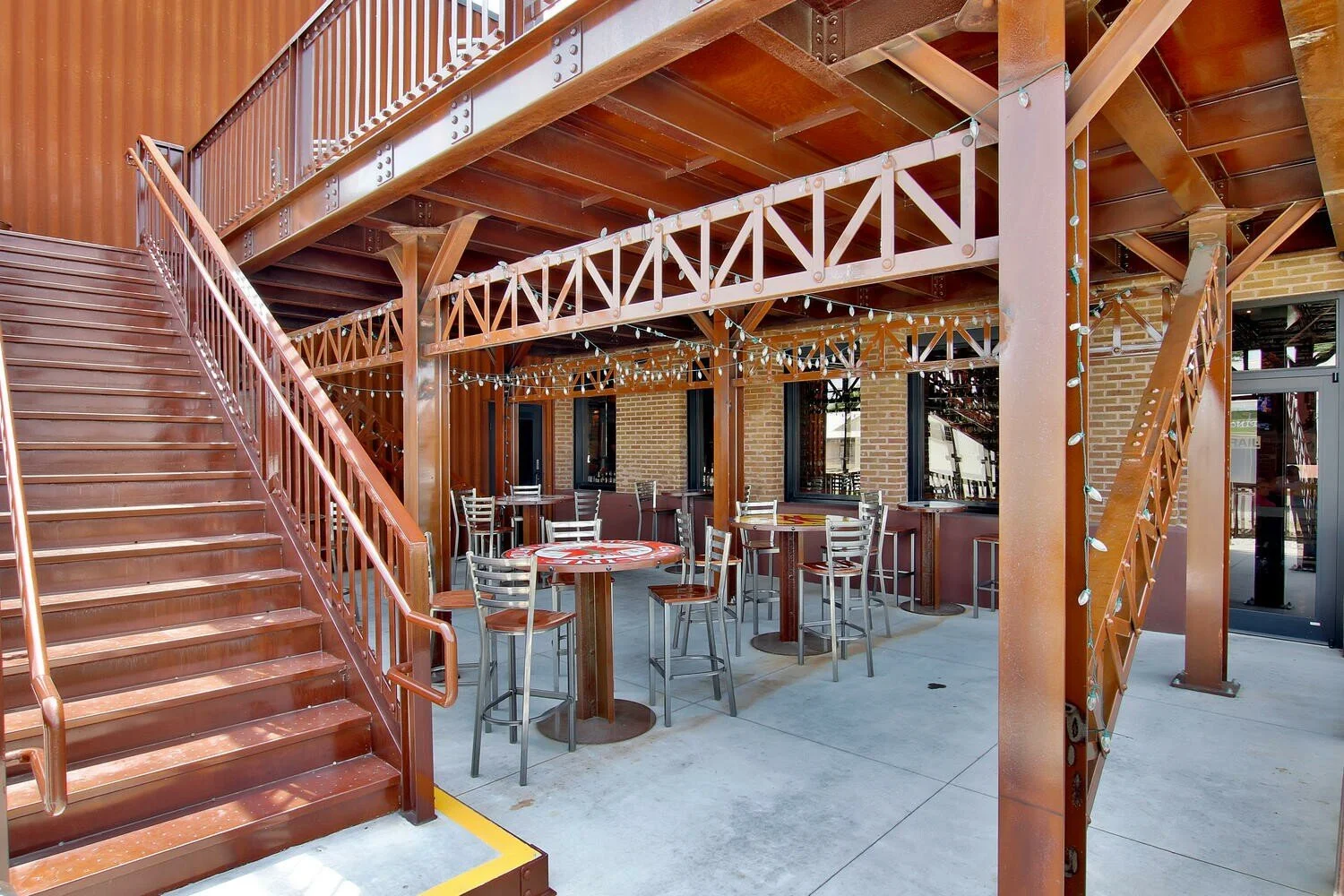 shindigs-restaurant-addition-renovation-train-depot-winfield-kansas-rooftop-deck-rivets