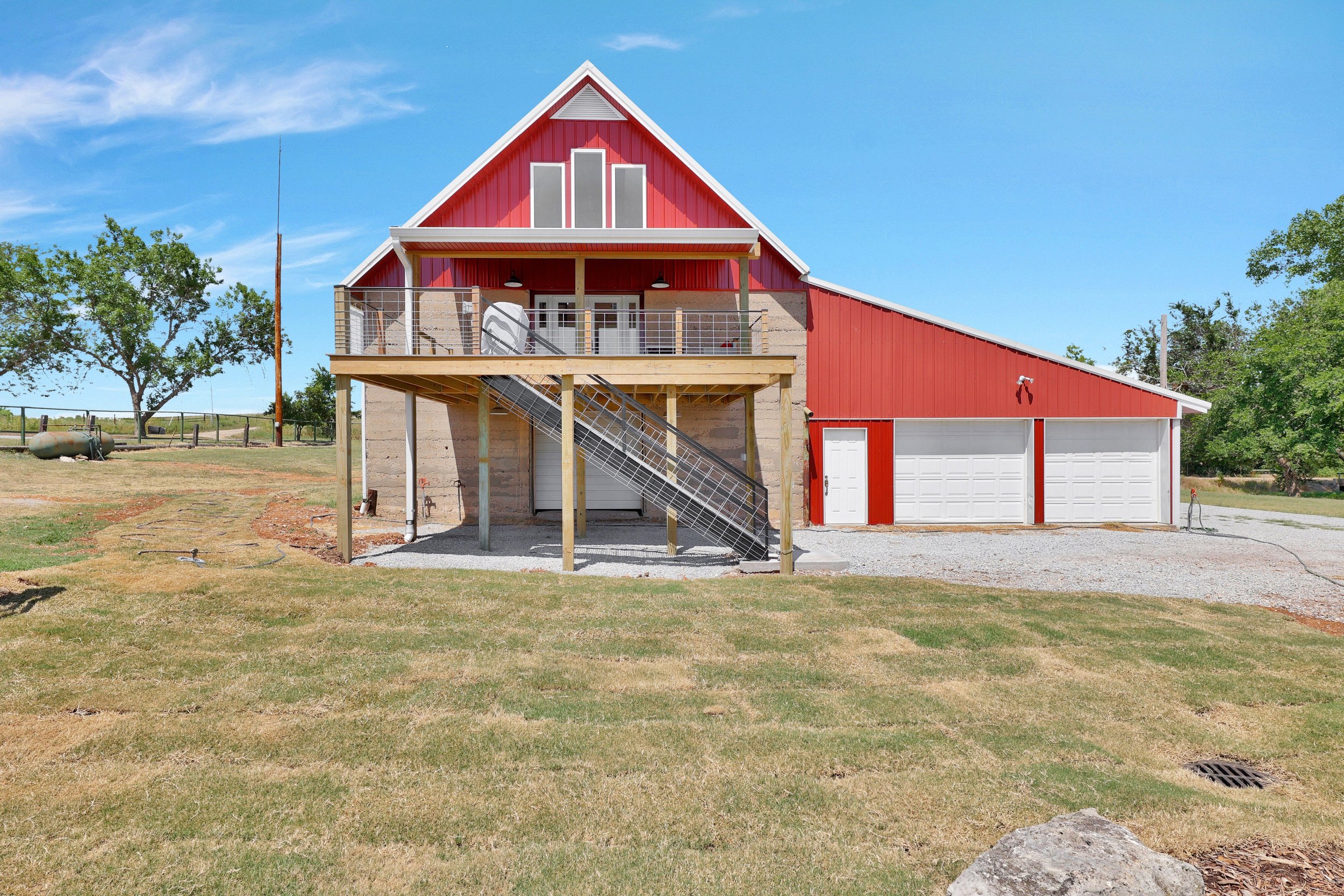 historic-barn-home-renovation-kansas-exterior-elevated-deck