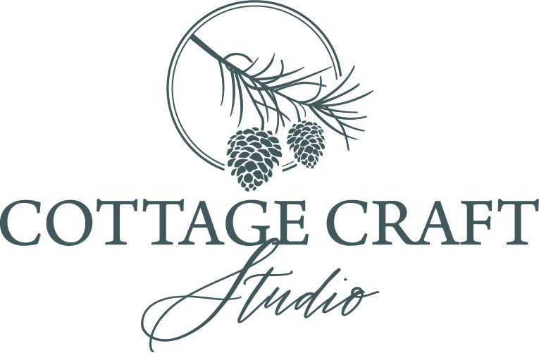 Logo with pinecones and pine branch above the words "Cottage Craft Studio" in stylized font.