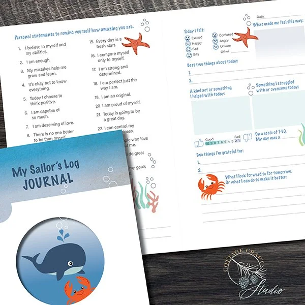 Open sailor's log journal with a whale and crab illustration cover, alongside a handwritten personal reflection sheet with starfish, seaweed, and seashells decorations.