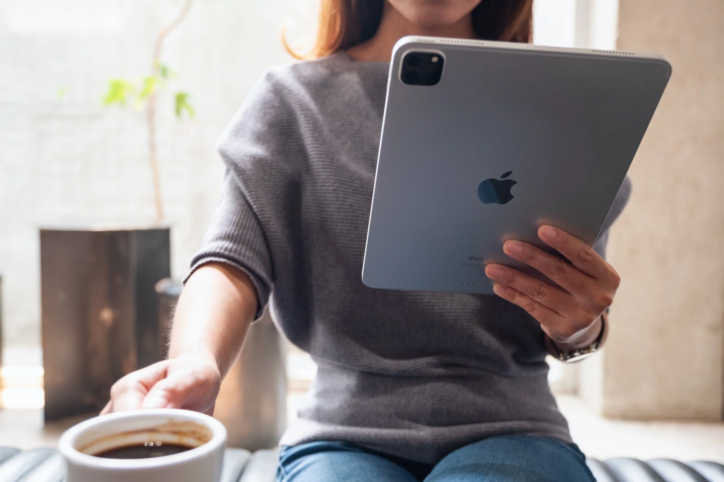 Woman viewing content on tablet.