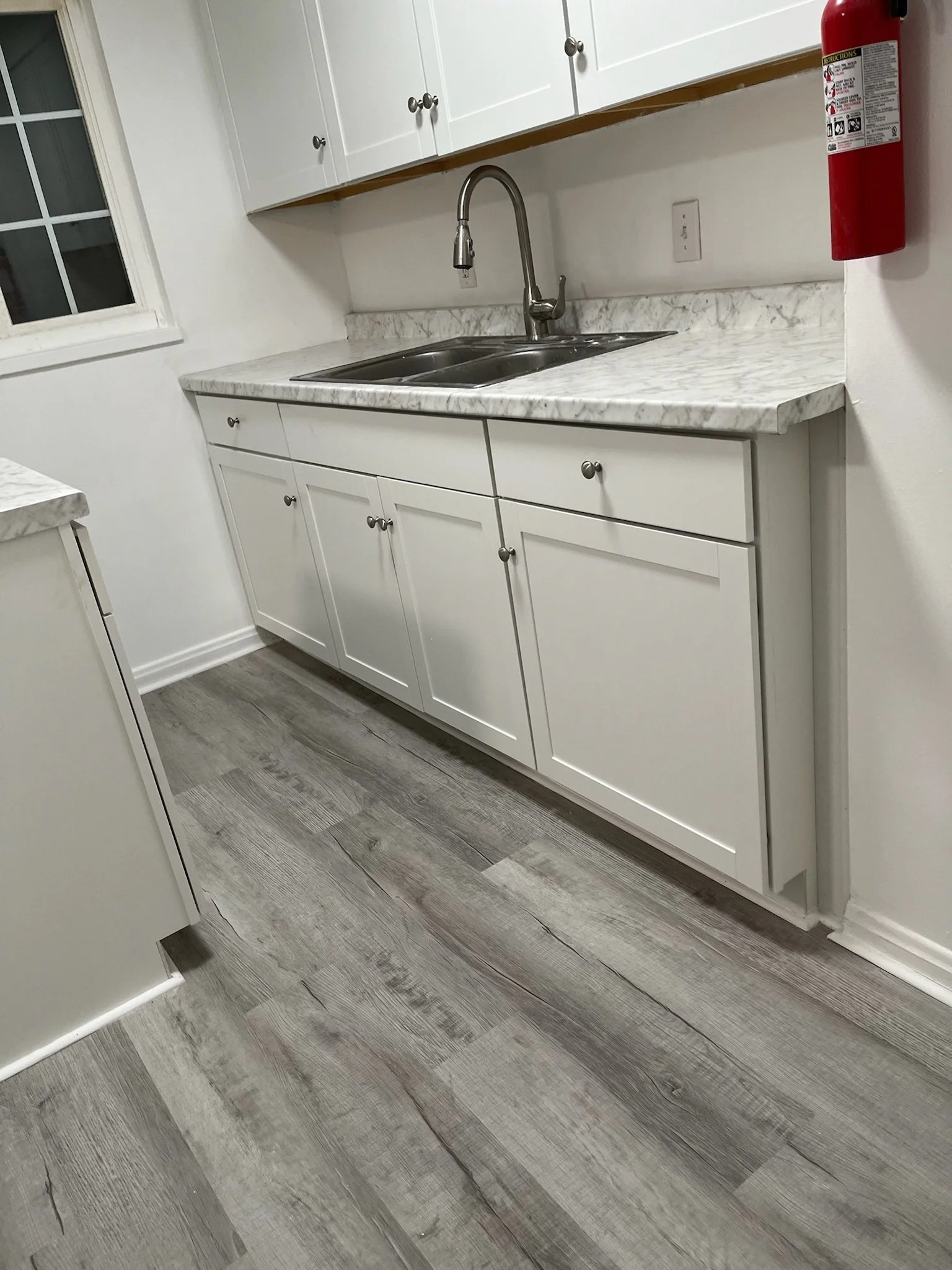 kitchen remodel Dayton Ohio LVP flooring installation seamless modern gray plank flooring