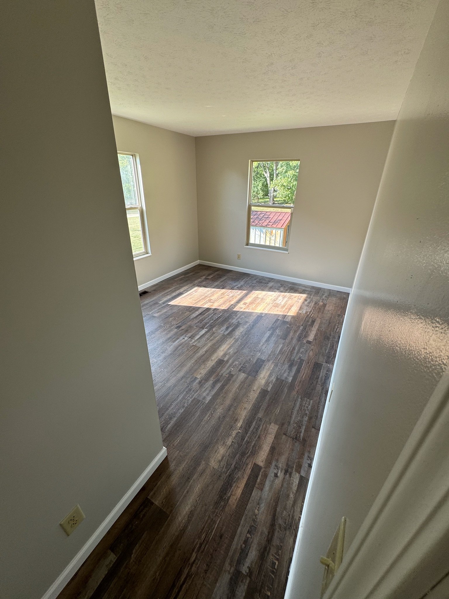 LVP flooring installation Dayton Ohio bedroom natural light wood style flooring upgrade