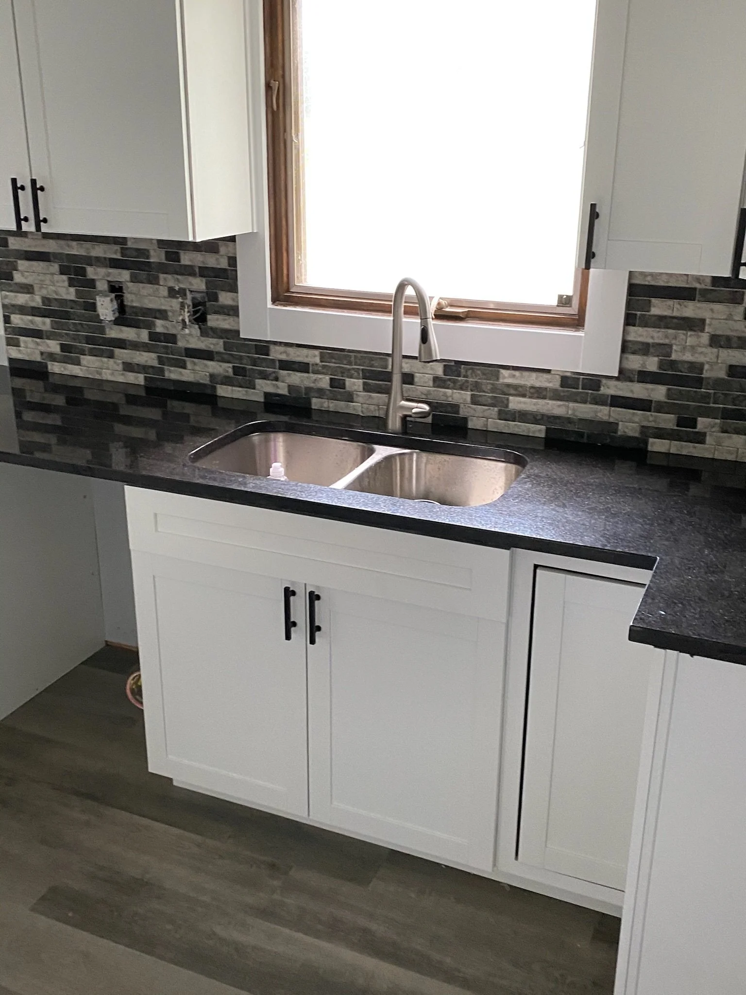 kitchen sink backsplash installation Dayton Ohio modern tile design with window lighting