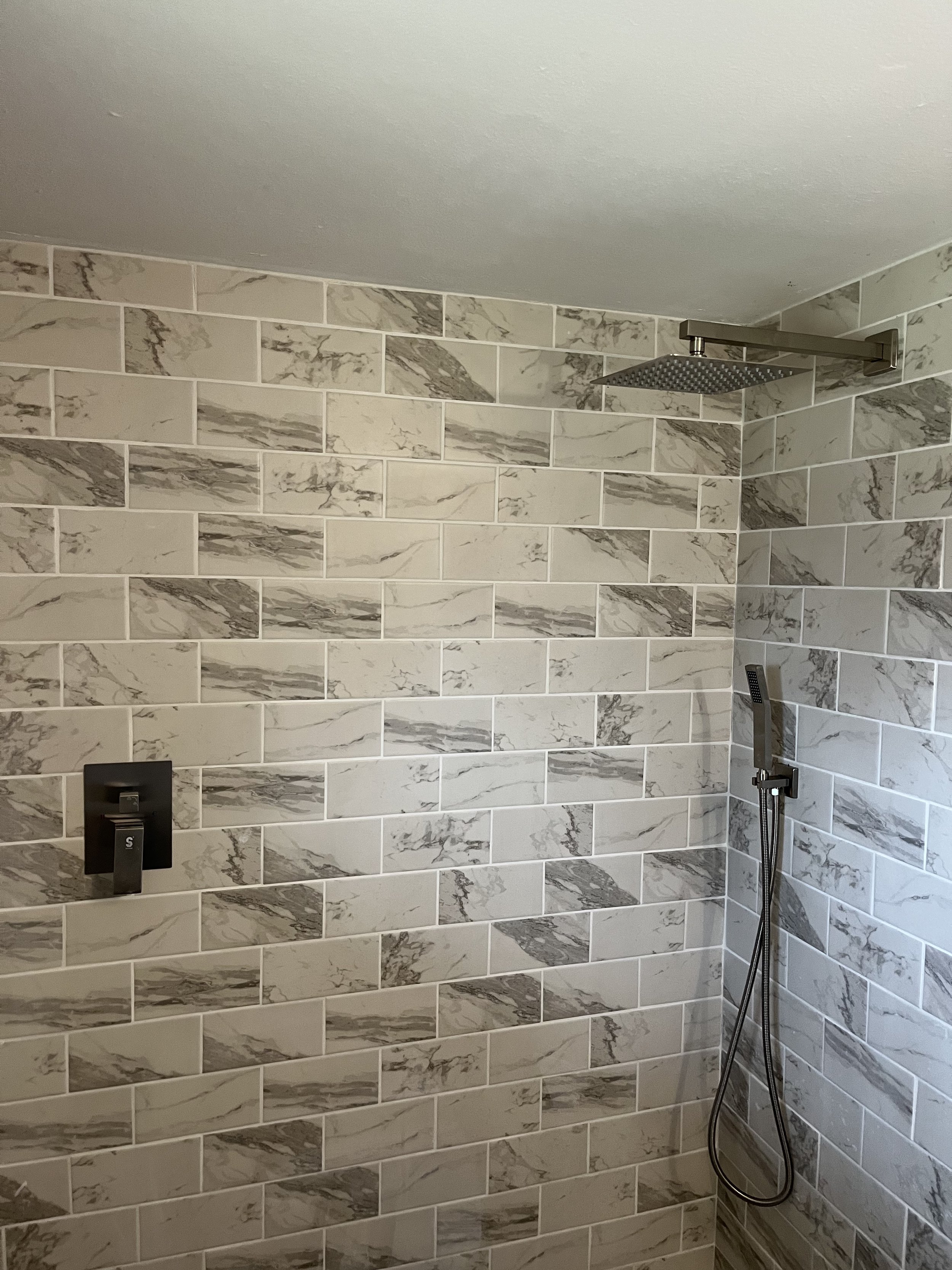 custom tile shower installation Dayton Ohio marble look wall tile modern bathroom remodel