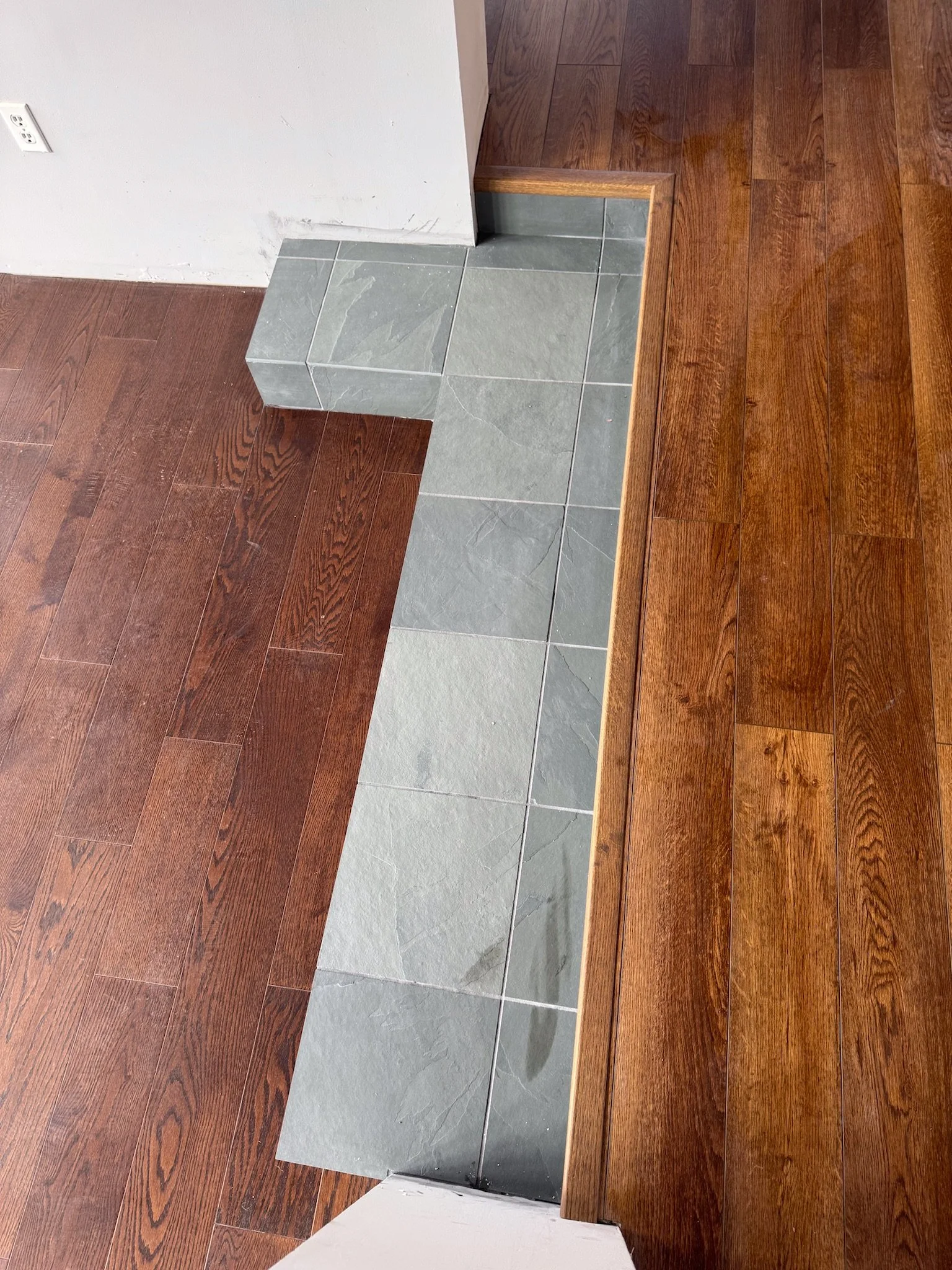 engineered hardwood and slate tile transition Dayton Ohio custom flooring installation detail