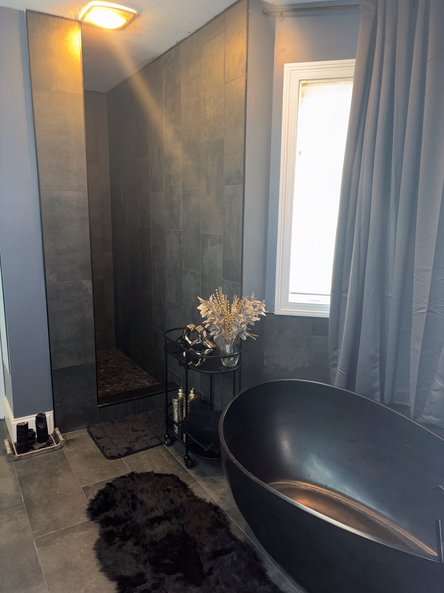 luxury bathroom remodel Dayton Ohio freestanding black soaking tub modern spa style bathroom