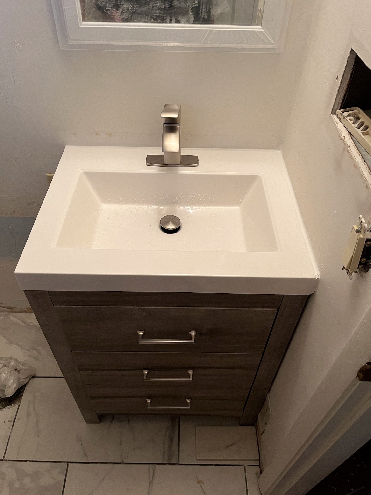 bathroom vanity installation Dayton Ohio modern sink cabinet and fixture upgrade