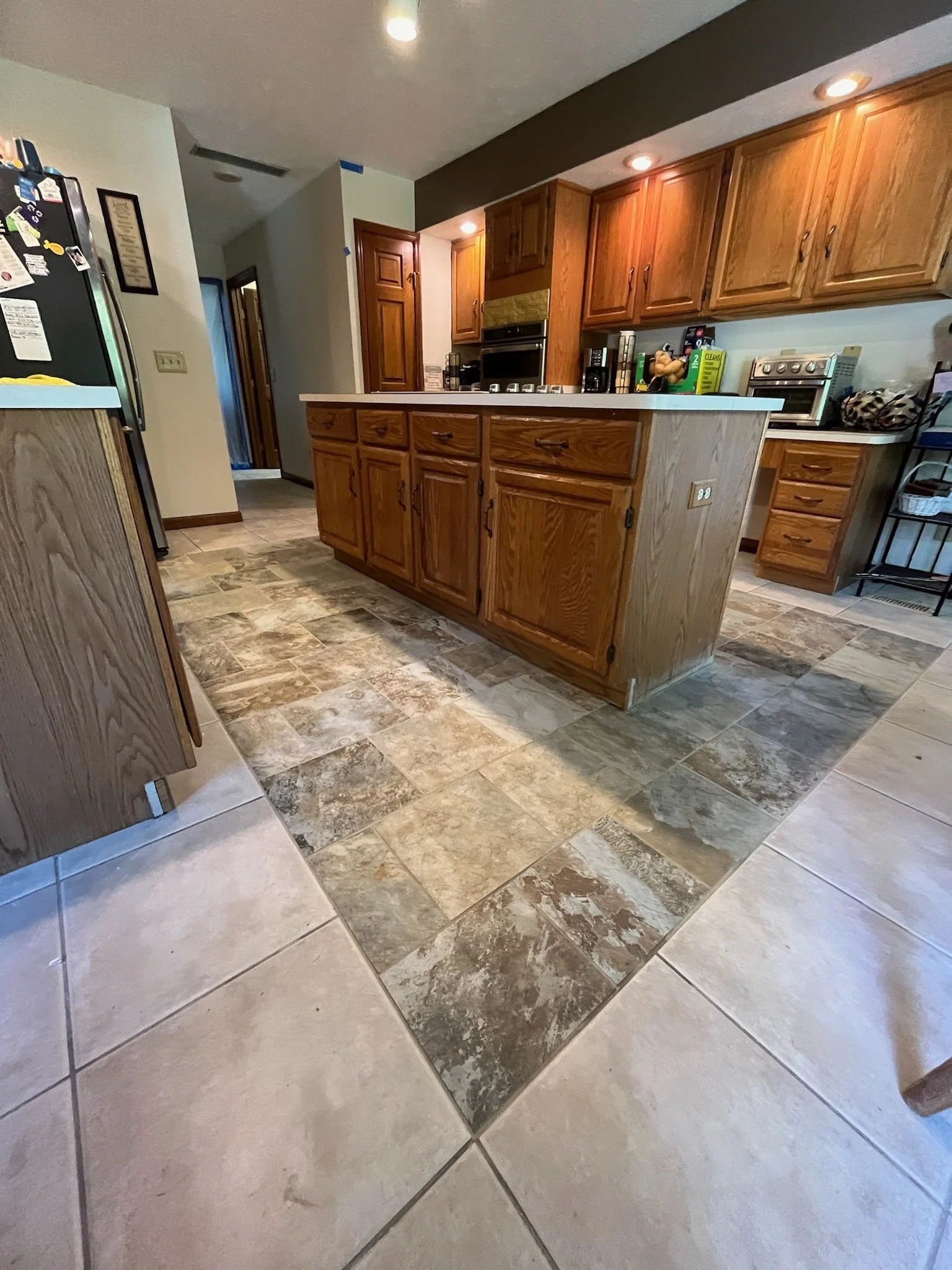 modern kitchen floor installation Dayton Ohio LVT flooring upgrade warm tone durable flooring