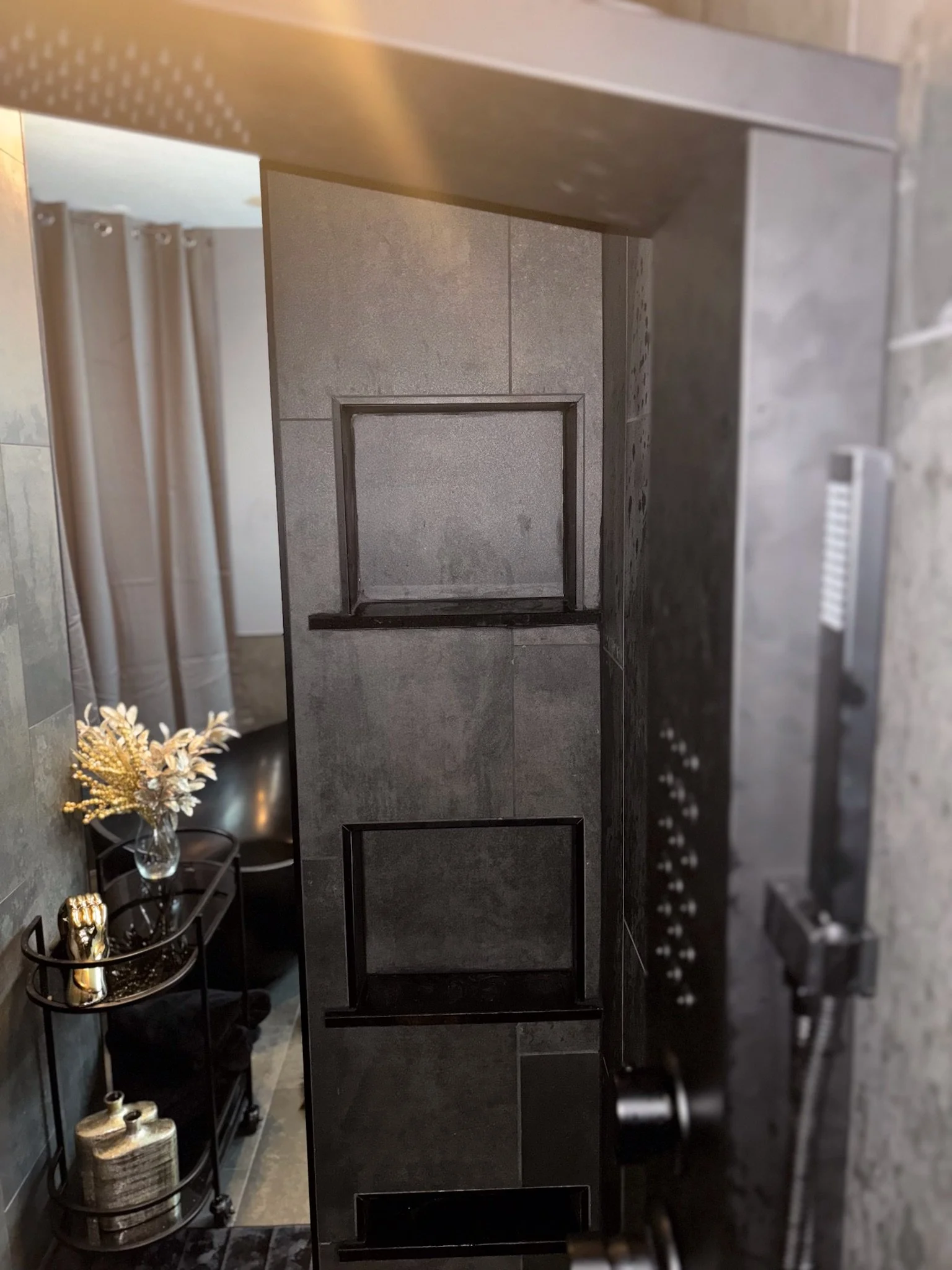custom tile shower remodel Dayton Ohio dark tile walk in shower with niche and modern fixtures