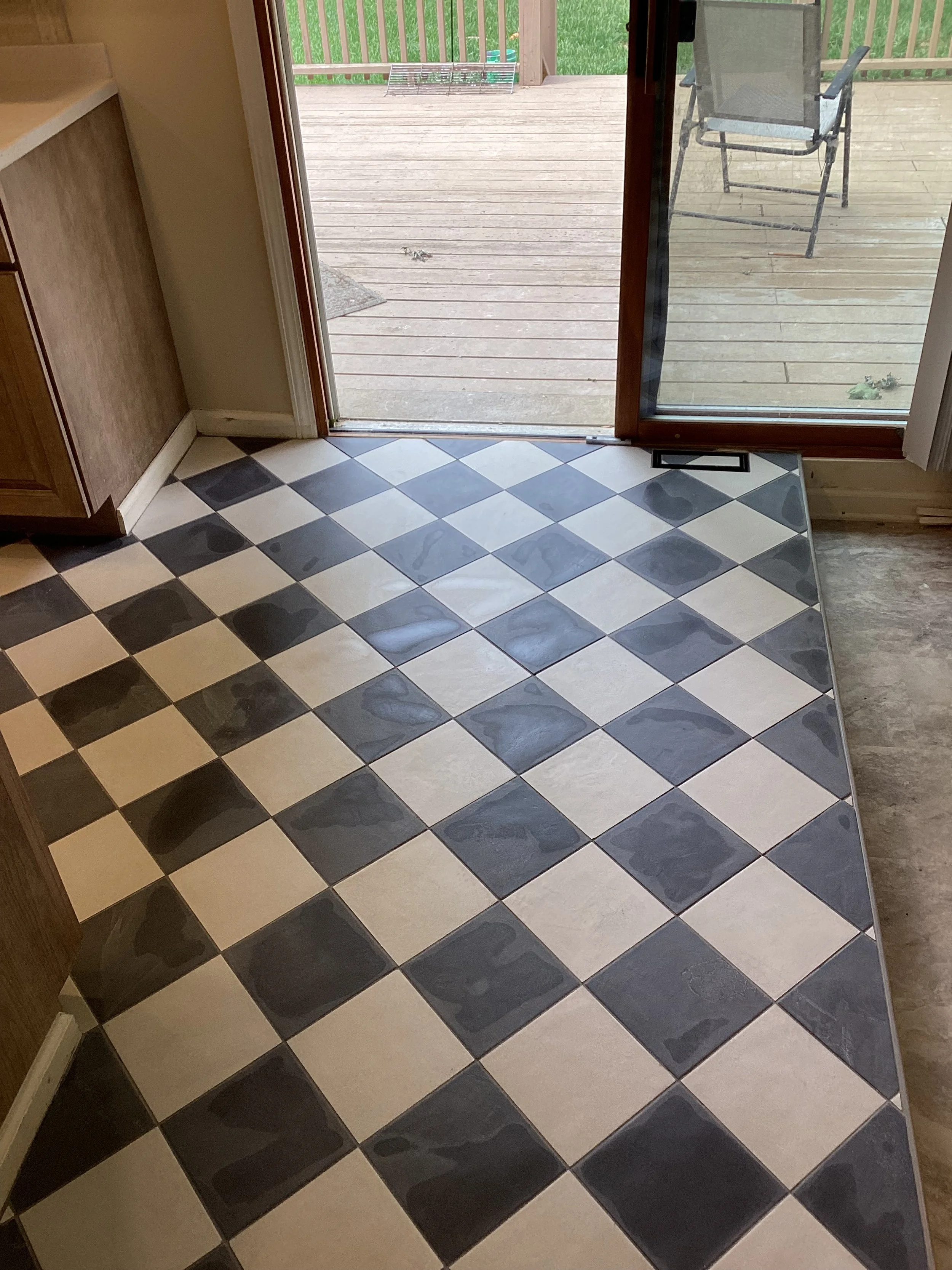 kitchen tile flooring installation Dayton Ohio checkered pattern near patio door