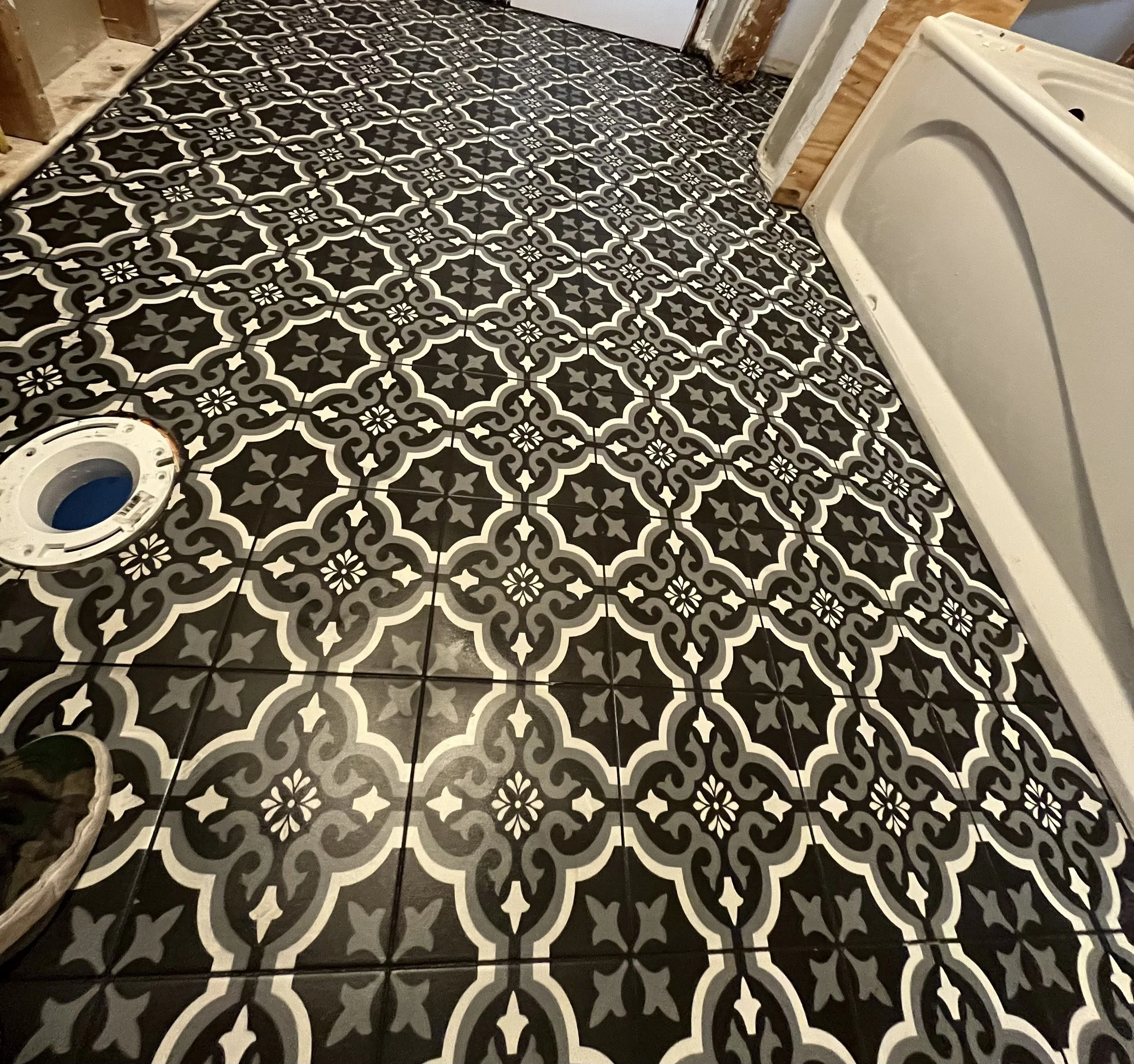 Customer gutted bathroom floor only ceramic tile hand laid