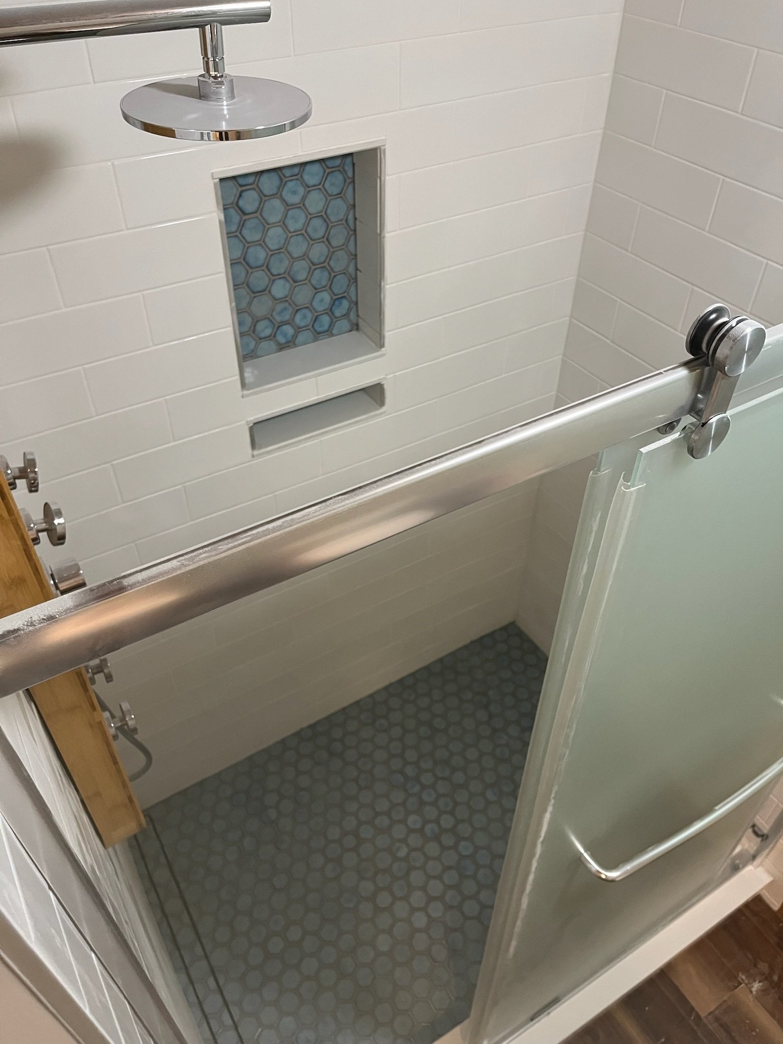 modern shower remodel Dayton Ohio glass door white subway tile shower with custom niche