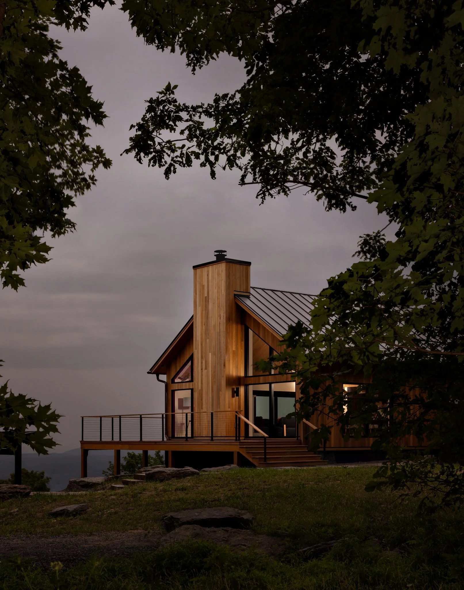 A contemporary Catskills chalet photographed at dusk in Greene Country NY by AD 100 NYC interiors hospitality lifestyle photographer Regan Wood