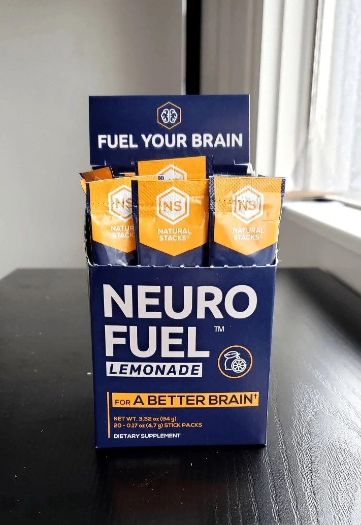 Neuro Fuel Lemonade box with sachets, dietary supplement for brain health by Natural Stacks on a table.