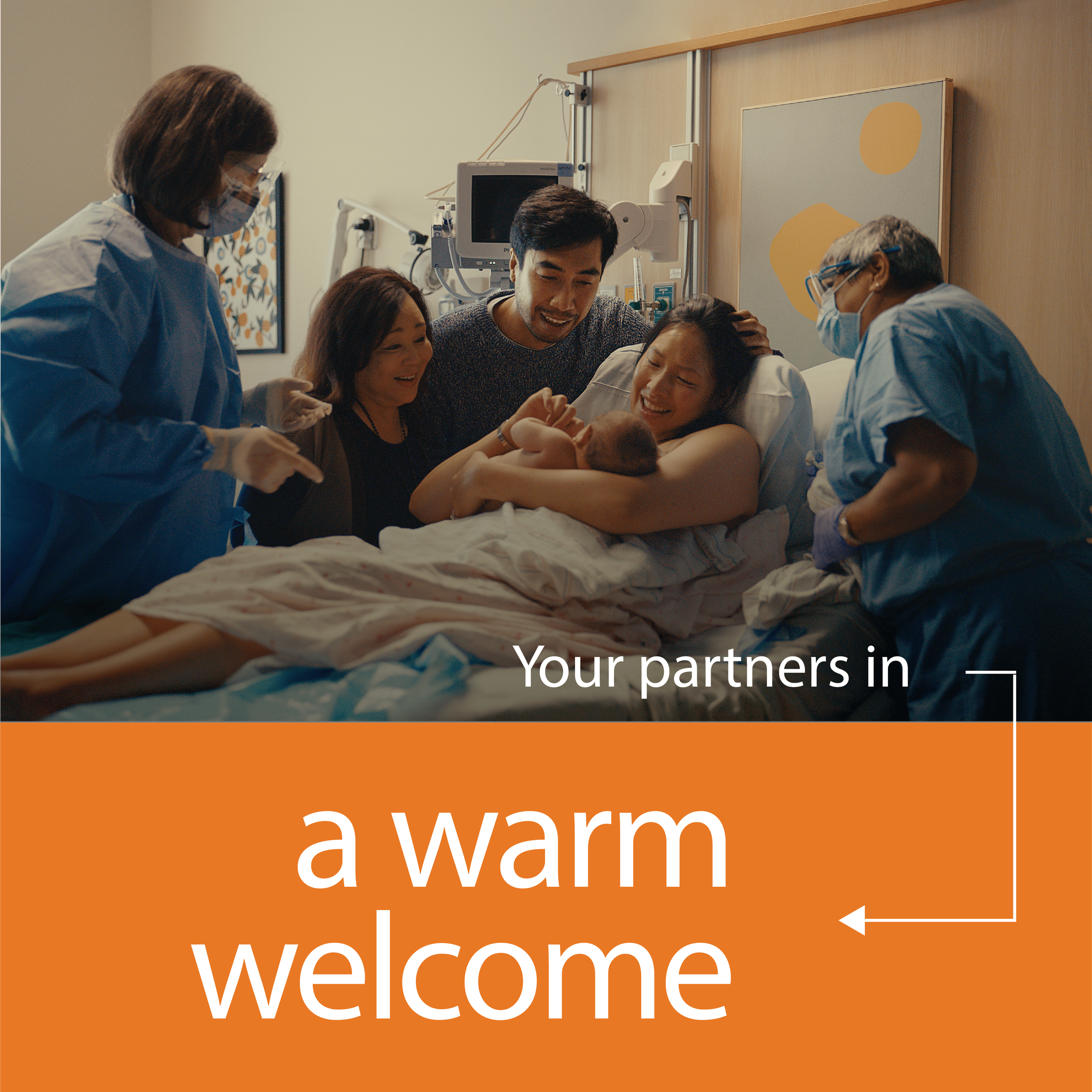 A joyful scene in a hospital room where a mother holds a newborn baby, surrounded by family and medical staff. The text reads, "Your partners in a warm welcome."