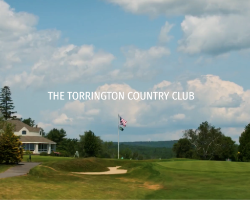 Golf course with a flag and the words 'The Torrington Country Club' on the sky background.