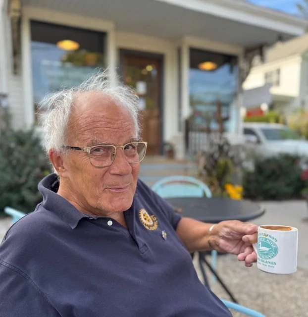 Chore client based in Salisbury holding a coffee cup and smiling
