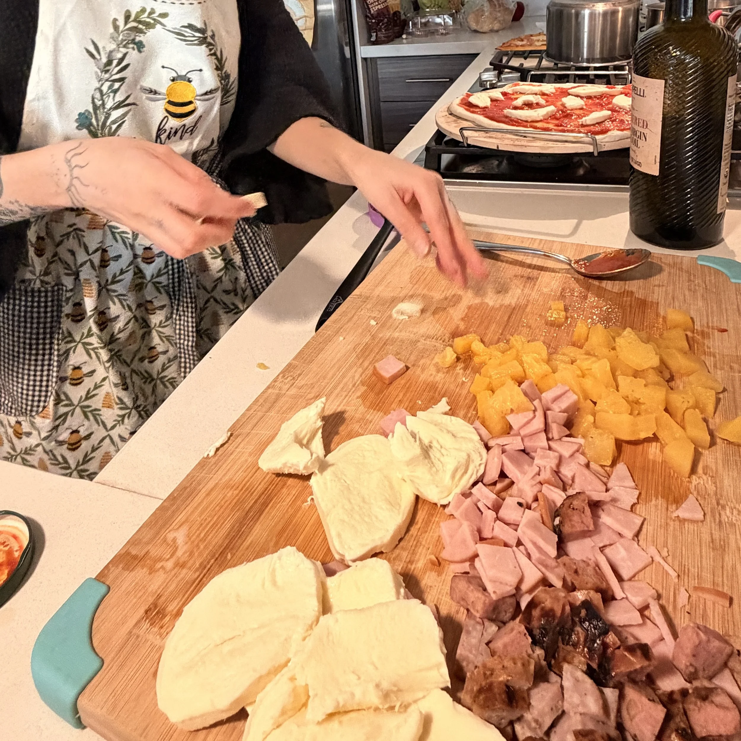 Hands preparing food in the kitchen as a mindful and nourishing self-care practice
