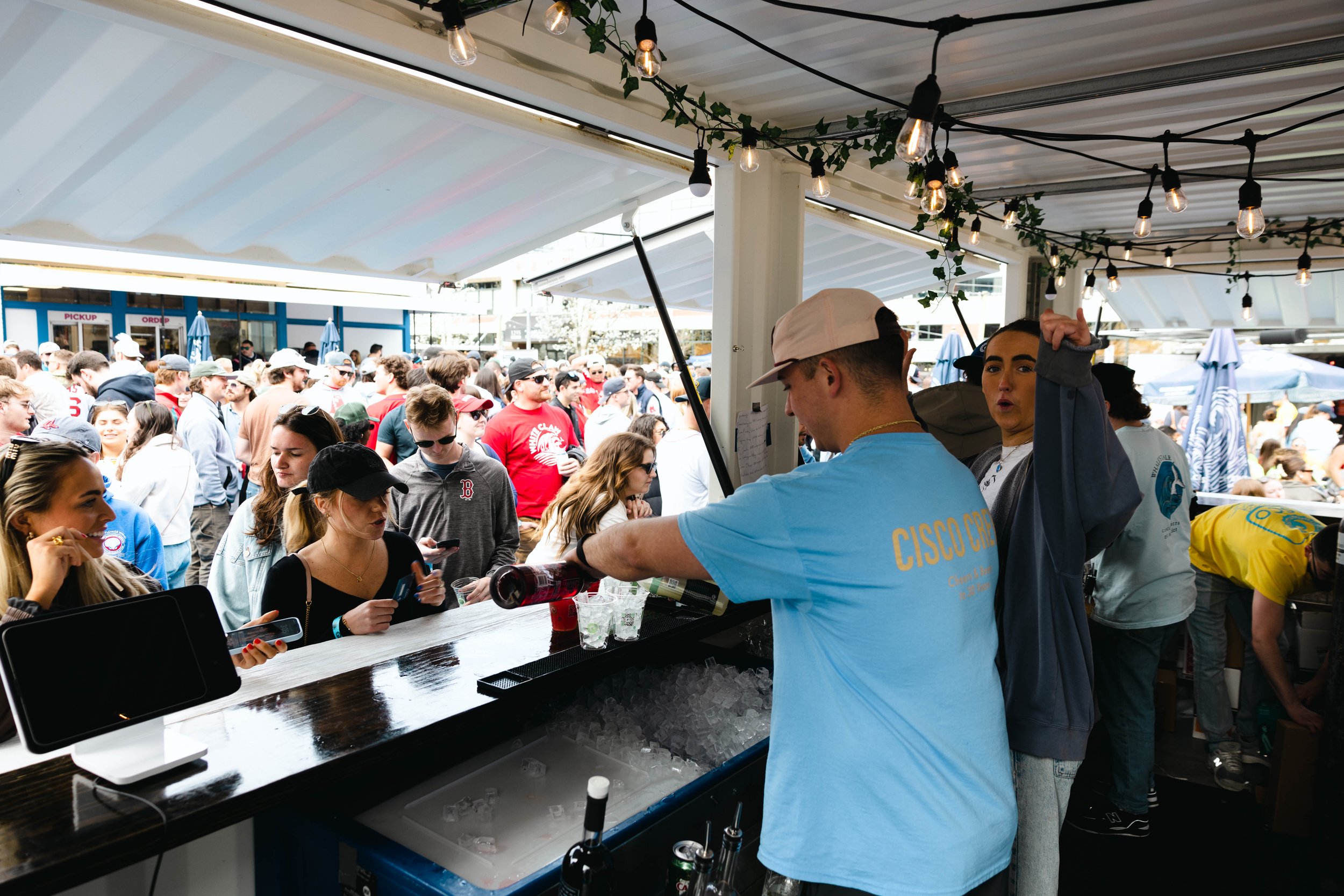 Cisco Fenway bartender making Triple Eight Distillery craft cocktails behind the bar