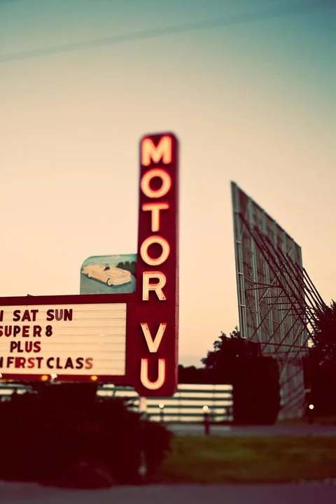parma motor-vu sign lit up with screen behind it