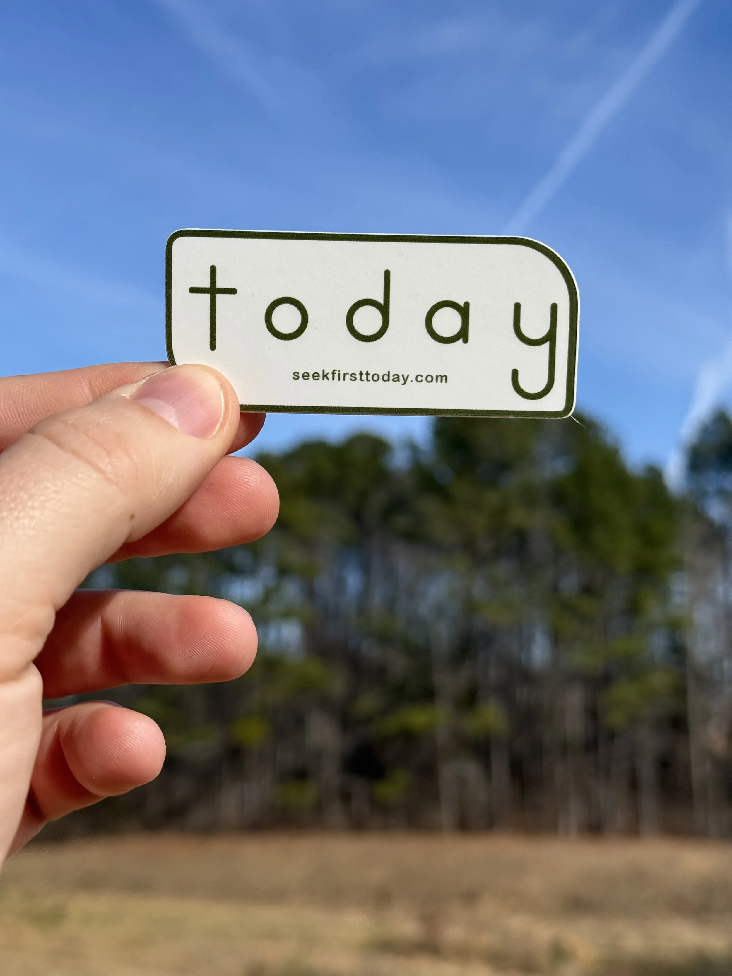 white-and-olive-seek-first-today-sticker-with-trees-and-blue-sky-in-background
