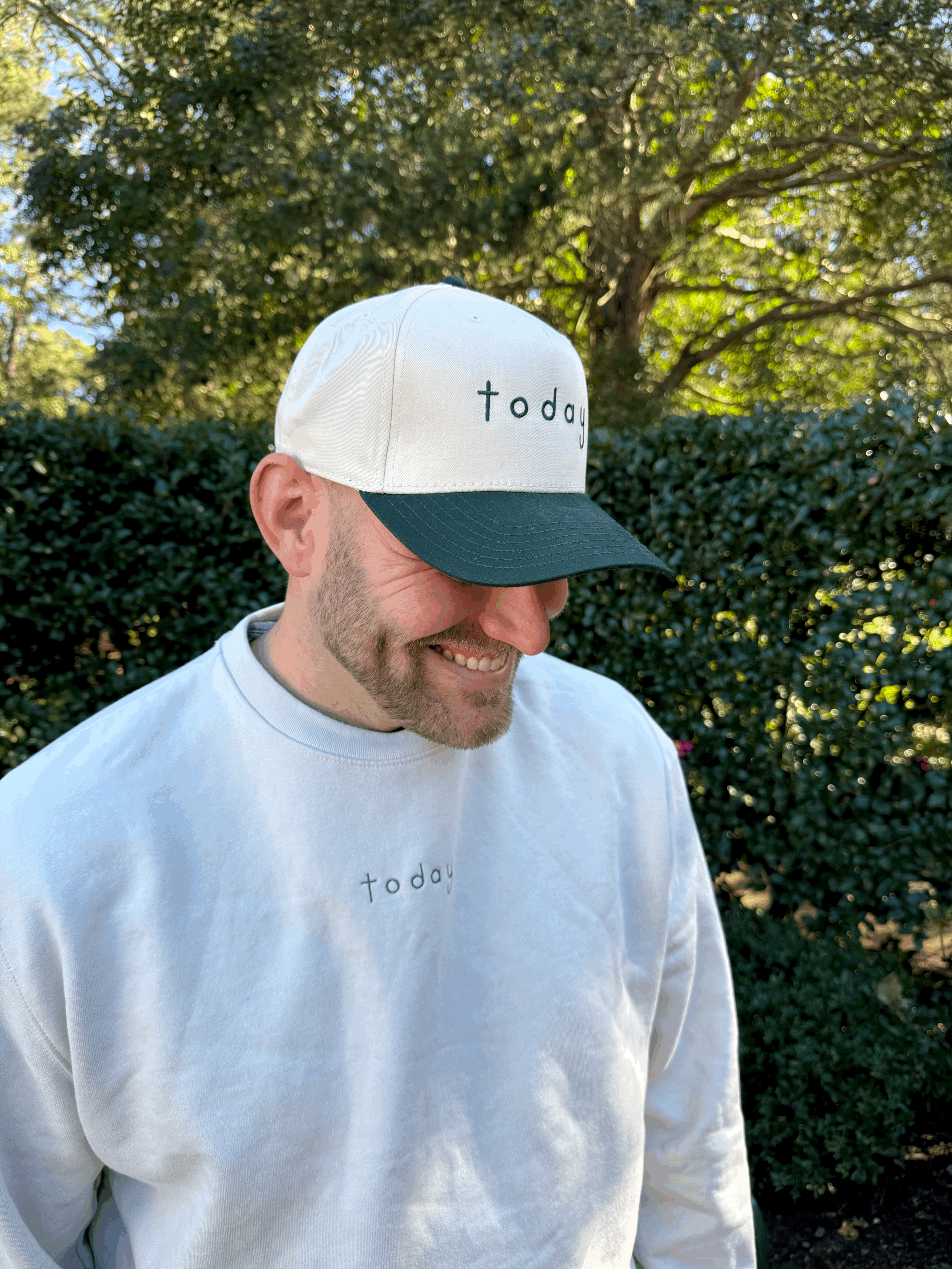 man- wearing-forest-green-five-panel-hat