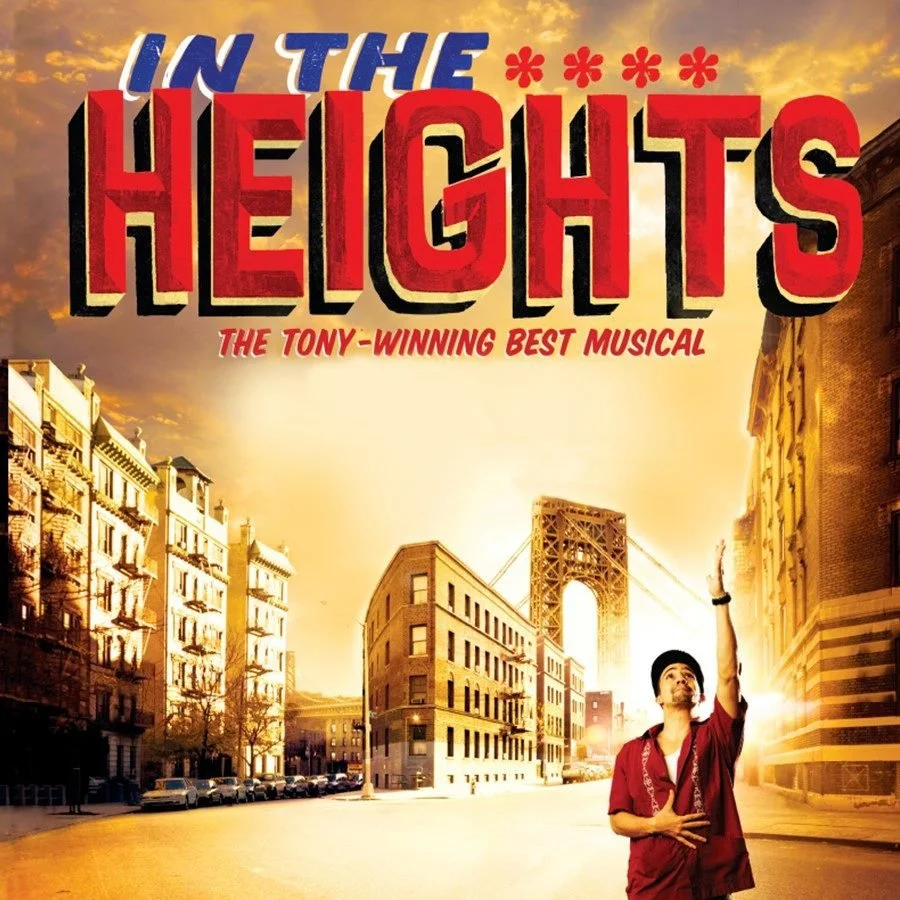 Poster for the musical 'In the Heights' featuring a city street scene with an urban bridge in the background, sunset lighting, and a performer in a red outfit reaching upward.